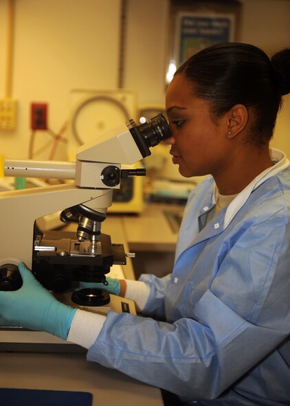 Staff Sgt. Adrienne Antonios, 4th Medical Operations Squadron medical lab technician, looks through a microscope to check for blood in a urine sample on Seymour Johnson Air Force Base, N.C., Jan. 5, 2010. Processing and performing analytical procedures on blood, urine and other body fluids are daily tasks completed by medical laboratory technicians. Antonios hails from St. Louis. (U.S. Air Force photo/Senior Airman Ciara Wymbs) 