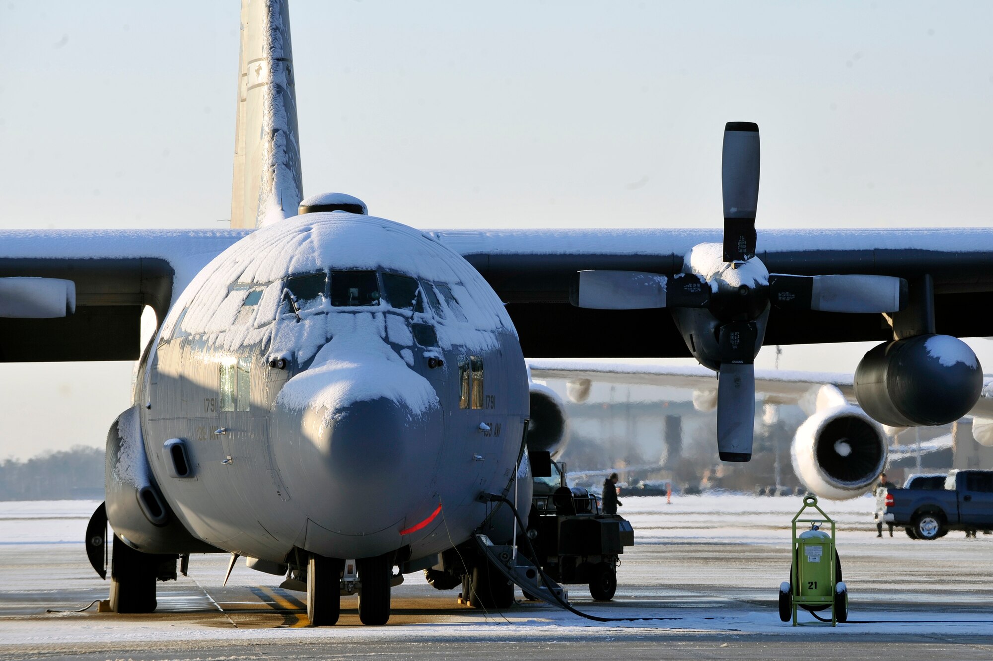 A snow-covered C-130 Hercules from the 139 Air Wing Missouri Air National Guard sits on the Joint Base Andrews flightline Jan. 8 after an overnight snow storm hit the National Capitol Region. Team Andrews members spent most of the morning de-iceing aircraft and clearing the flightline of snow and ice. (U.S. Air Force photo by Airman 1st Class Perry Aston)