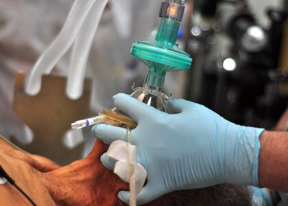 Air Force Lt. Col. Kenneth Williams applies anesthesia to a 79-old Honduran man during an operation by the Mobile Surgical Team from Joint Task Force-Bravo, Soto Cano Air Base Jan. 6 at the Santa Teresa Hospital in Comayagua, Honduras. JTF-B is committed to partnering with countries through Central America for training and missions to support security, stability and prosperity throughout the region. (U.S. Air Force photo/Staff Sgt. Bryan Franks)