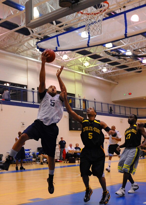 LANGLEY AIR FORCE BASE, Va. -- DeMario Daniels, 633d Medical Group, attempts a lay-up in an intramural basketball game against the 735th Supply Chain Management Group Jan. 7 at the Shellbank Fitness Center. The 633d MDG won the game 48-27. (U.S. Air Force photo/Airman 1st Class John Teti)