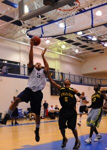 LANGLEY AIR FORCE BASE, Va. -- DeMario Daniels, 633d Medical Group, attempts a lay-up in an intramural basketball game against the 735th Supply Chain Management Group Jan. 7 at the Shellbank Fitness Center. The 633d MDG won the game 48-27. (U.S. Air Force photo/Airman 1st Class John Teti)