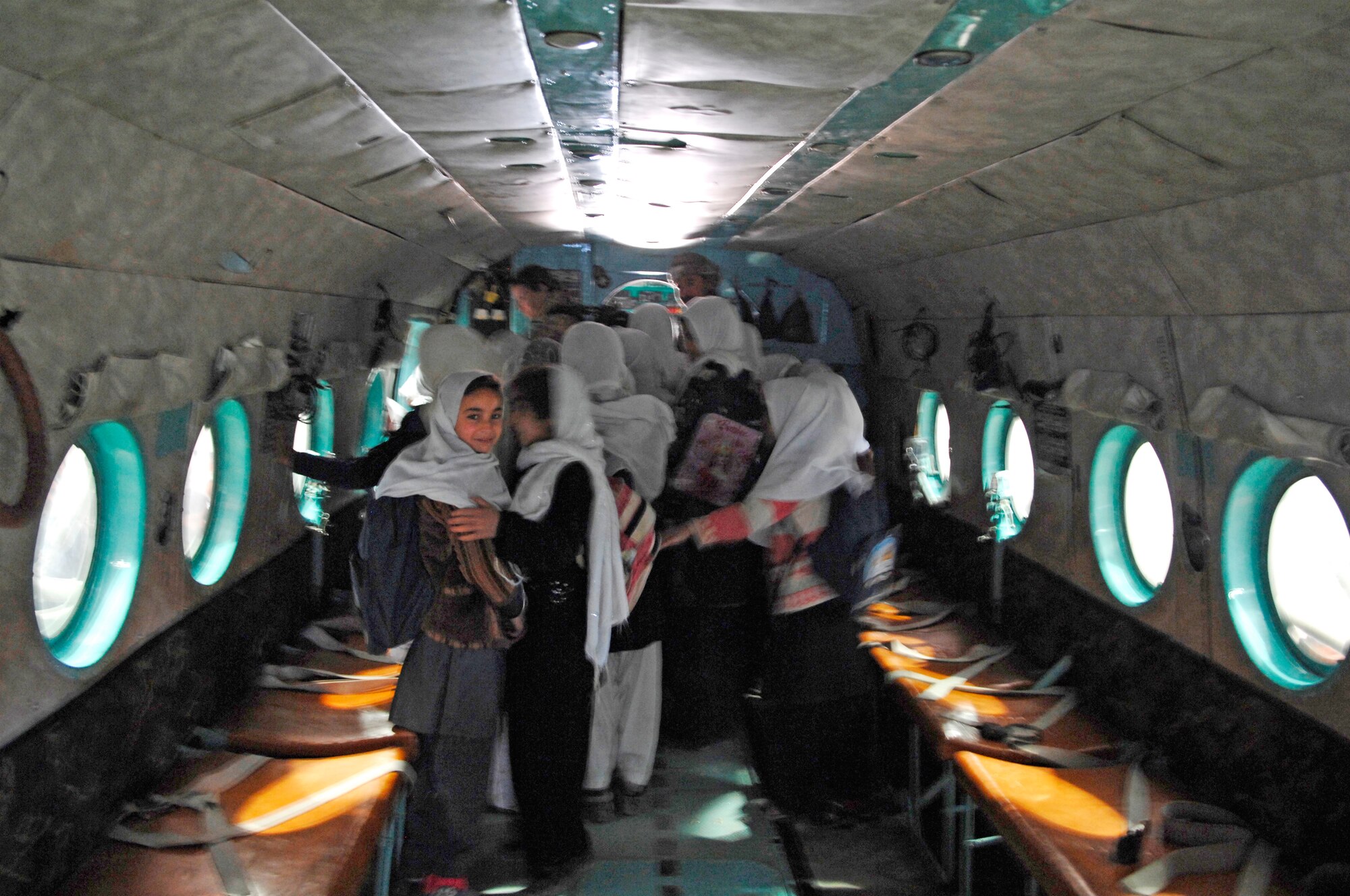 Afghan students tour an Mi-17 helicopter Dec. 31, 2009, during their visit to the Afghan National Army Air Corps hangar. (U.S. Air Force photo/Staff Sgt. Angelique N. Smythe)