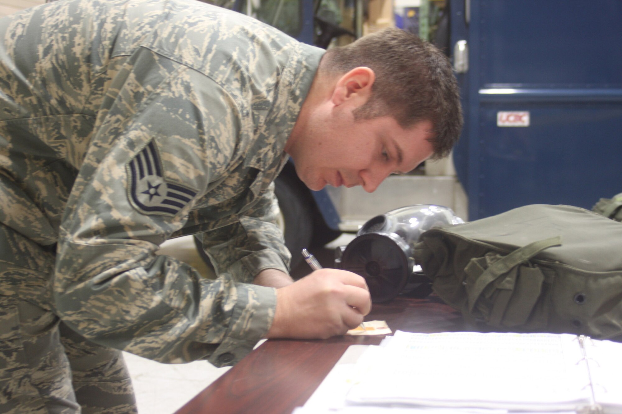 WRIGHT-PATTERSON AIR FORCE BASE, Ohio – Staff Sgt. Ryan Maloney, 445th Logistics Readiness Squadron, inventories a chemical/biological mask after inspecting it to make sure it is serviceable.  Sergeant Maloney routinely inventories the masks to make sure they are always serviceable and readily available.  (U.S. Air Force photo/Senior Airman Mikhail Berlin)