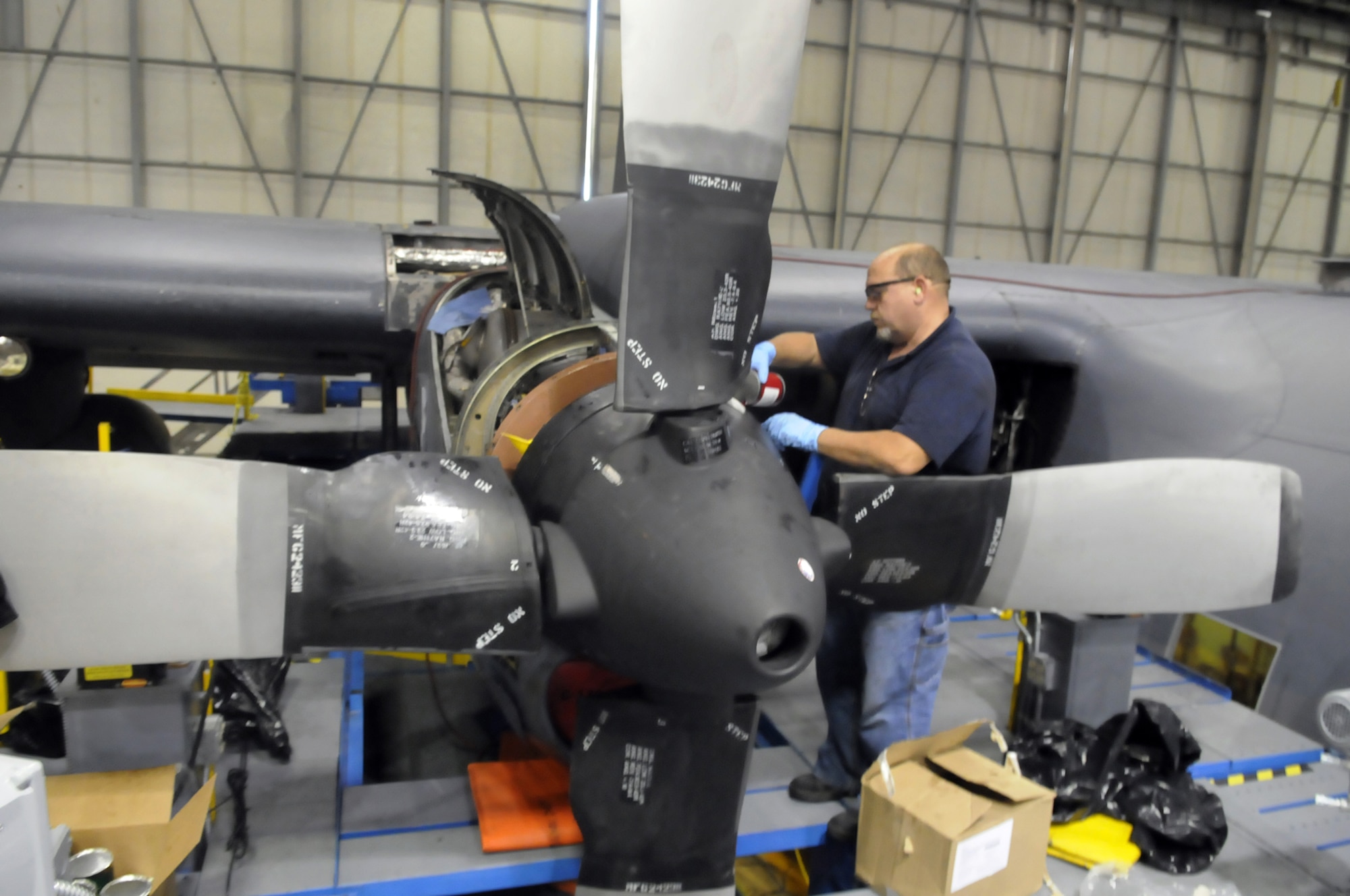 Steve Welchel works on one of the engines of the C-130 undergoing HVM Dec. 17. U. S. Air Force photo by Sue Sapp