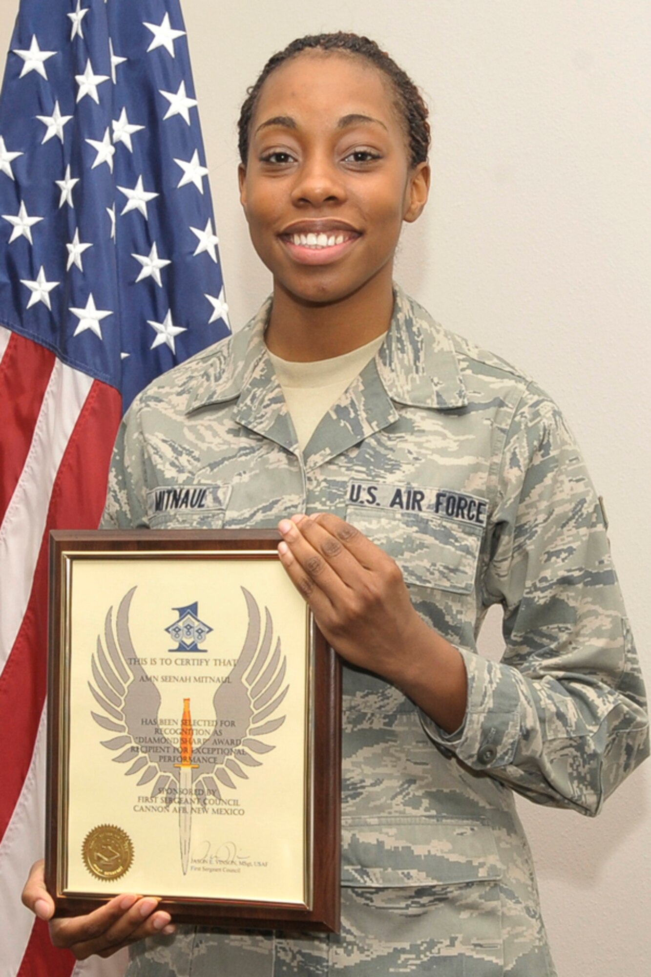 CANNON AIR FORCE BASE, N.M.-- Airman Seenah Mitnaul, 27th Special Operations Medical Support Squadron, displays her Diamond Sharp Award presented Jan. 8.  Diamond Sharp awards recognize Airmen for their superior job performance, leadership skills, as well as dress and appearance. (U.S. Air Force photo by Staff Sgt. Heather R. Redman)