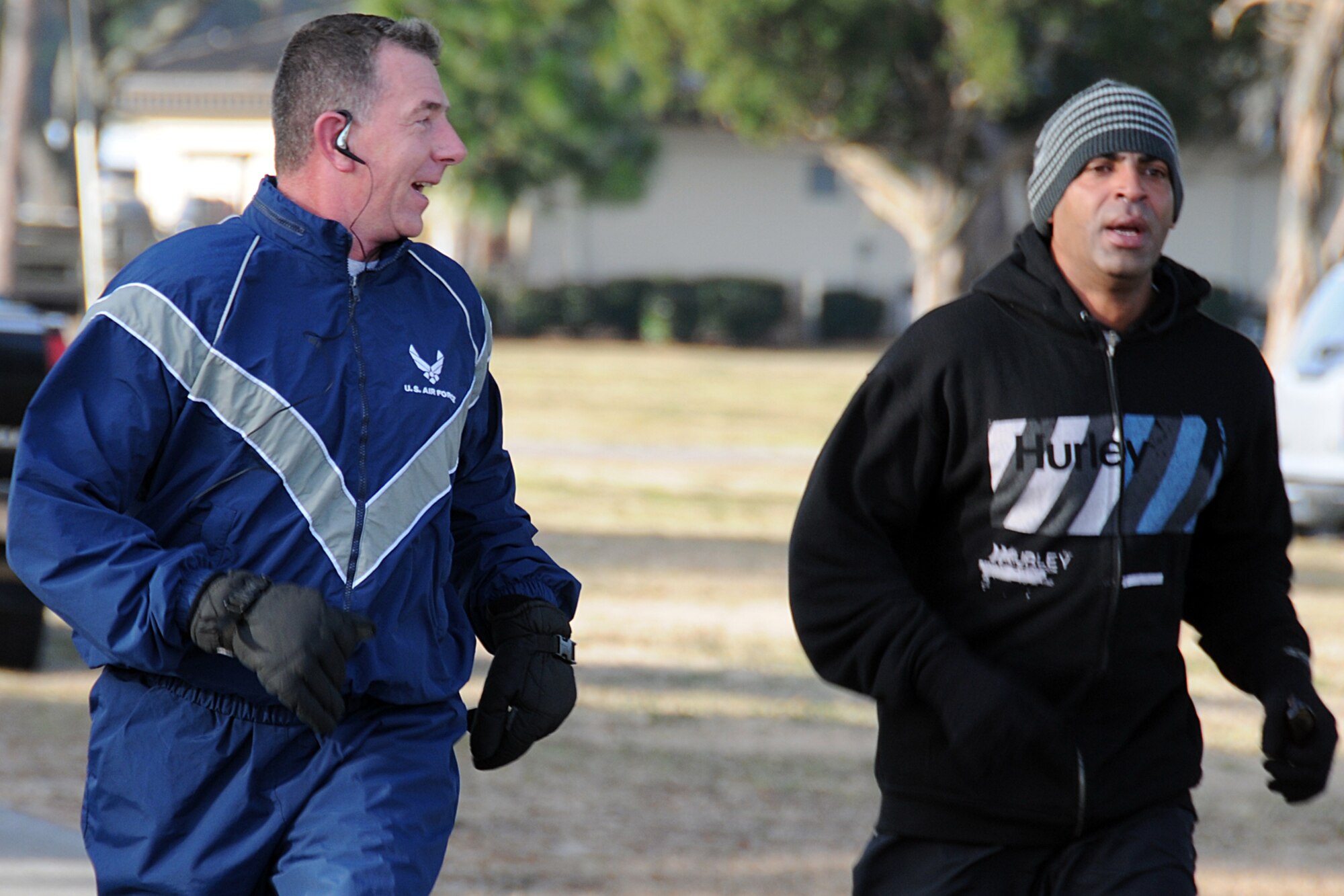 EGLIN AIR FORCE BASE, Fla. --  Chief Master Sgt. Thomas Westermeyer, 96th Air Base Wing and Air Armament Center command chief, motivates a fellow runner during the Resolution 5K, Jan. 8. The event was sponsored by the 96th Force Support Squadron as a way to promote fitness for those whose New Year’s resolution was to get back or stay in shape. Twenty runners braved the 25 degree temperatures and 10 degree wind chill to maintain a resolution or just get some needed exercise. (U.S. Air Force photo/ Airman 1st Class Anthony Jennings)