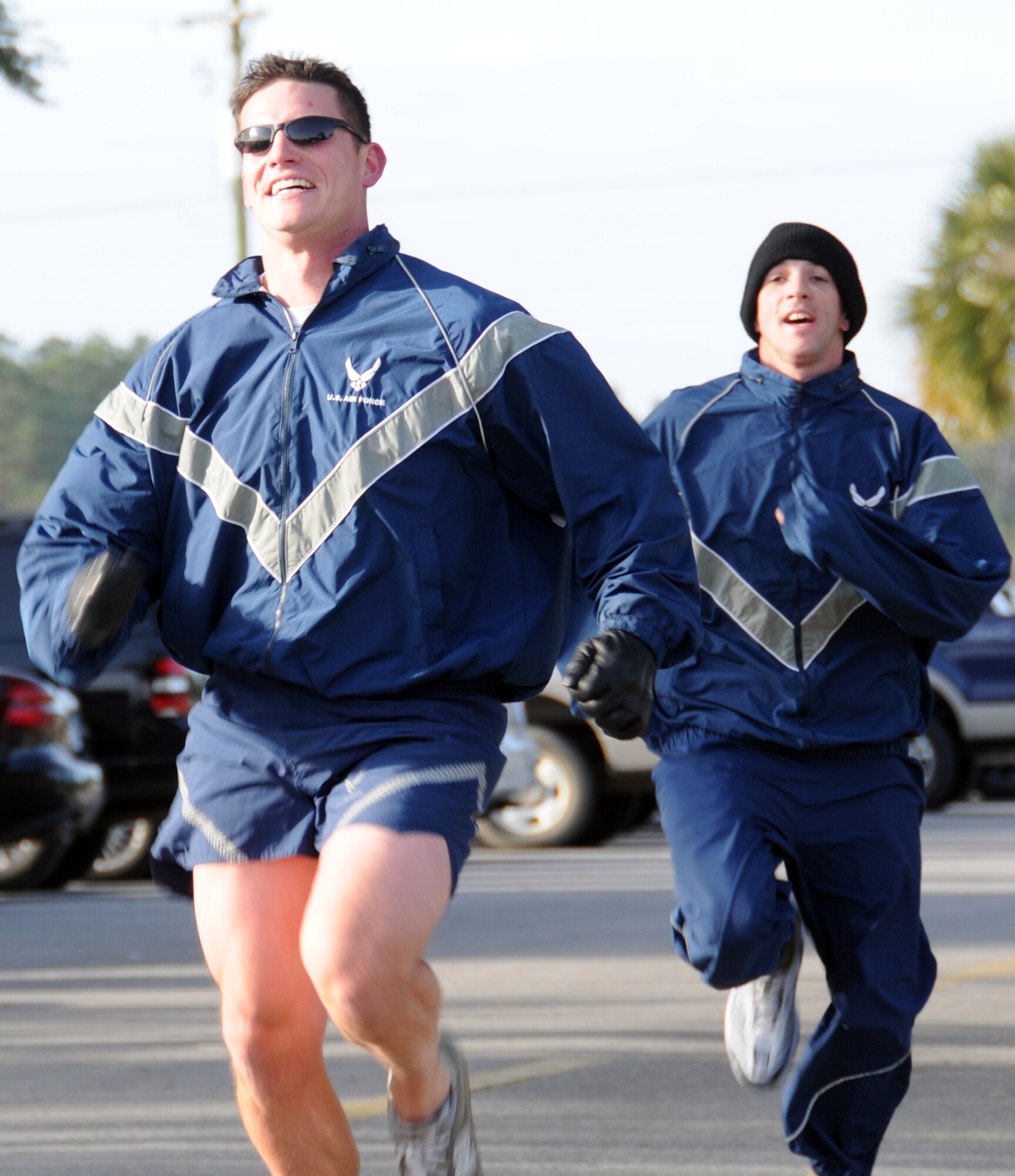 EGLIN AIR FORCE BASE, Fla. –  Runners race down the final stretch to the finish line during the Resolution 5K, Jan. 8. The event was sponsored by the 96th Force Support Squadron as a way to promote fitness for those whose New Year’s resolution was to get back or stay in shape. Twenty runners braved the 25 degree temperatures and 10 degree wind chill to maintain a resolution or just get some needed exercise. (U.S. Air Force photo/ Airman 1st Class Anthony Jennings) 