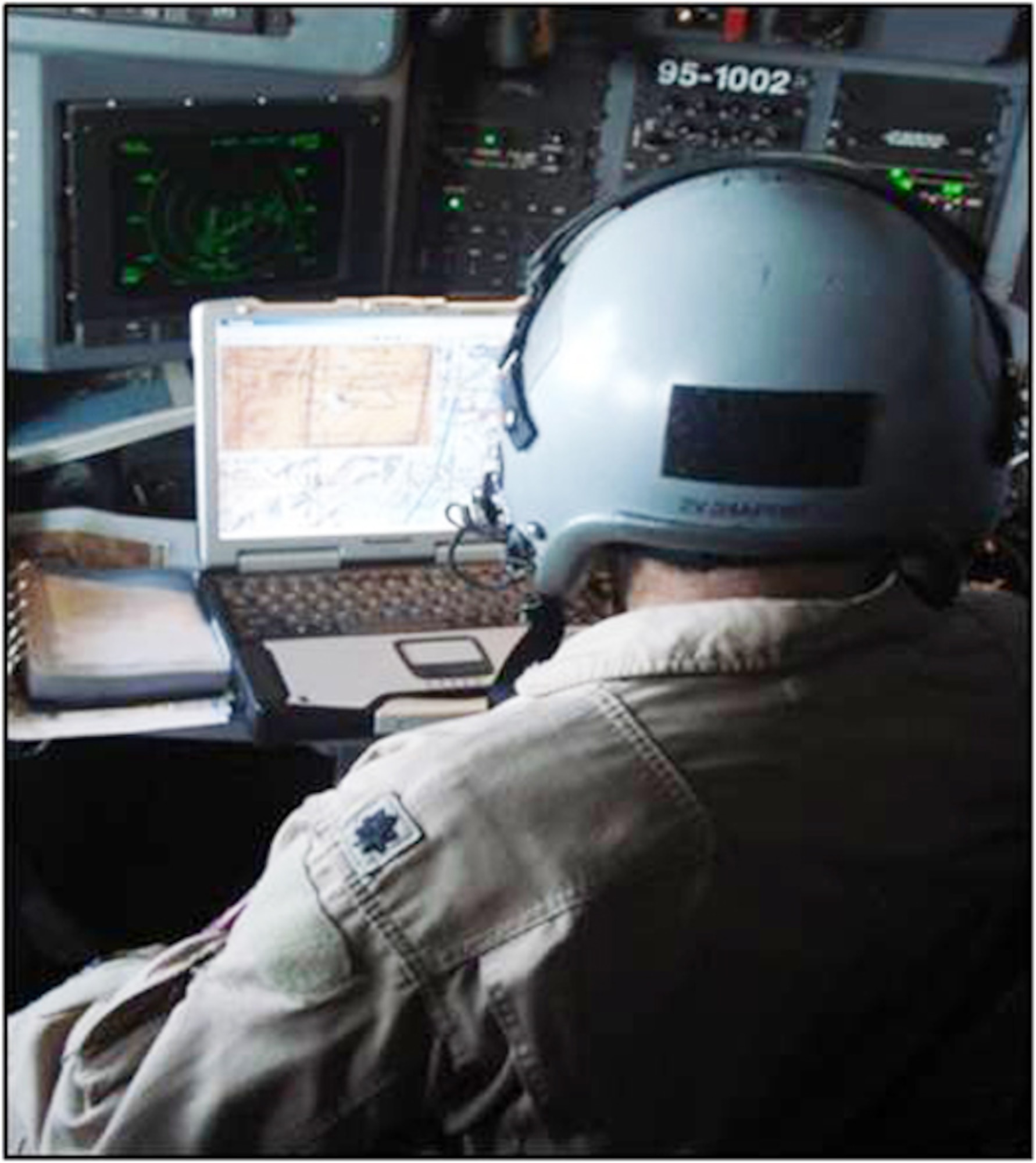 An aircrew member uses the Combat Track II system, the 500th system was delivered to the field last month. Combat Talon II allows crew aboard the air mobility fleet, as well as on some bombers, to maintain full awareness of friendly and potential hostile aircraft positions. It also alerts them to ground threats, including mobile surface-to-air missile sites. (Courtesy photo)