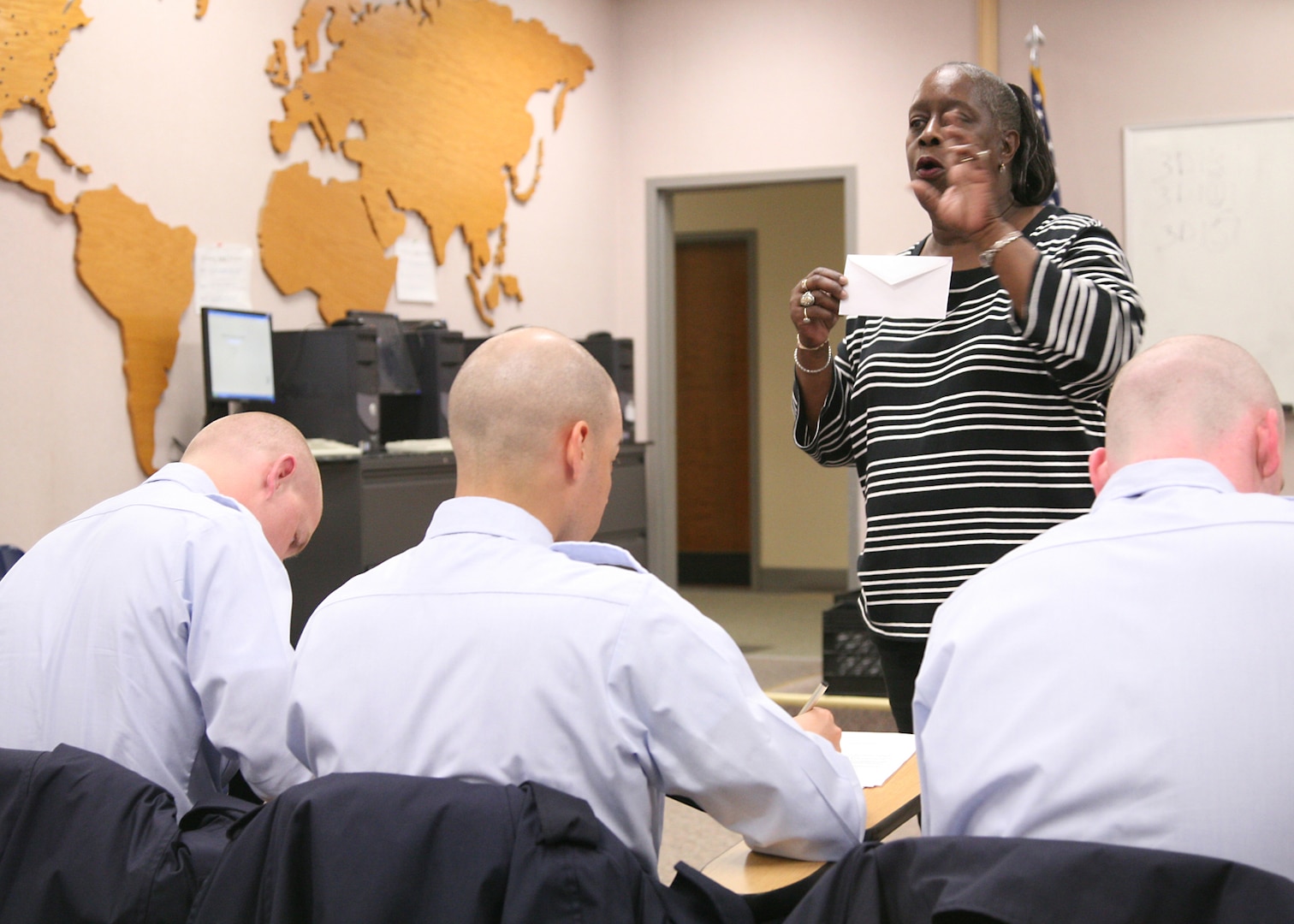 Ernestine Manigault, 37th Training Wing Public Affairs, helps BMT trainees complete the Hometown News Release form. The program is open to military and civilians. (U.S. Air Force photo/Robbin Cresswell)