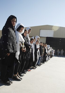 Approximately 250 children from local schools in Kandahar City visited the Afghanistan National Army Air Corps hangar on Kandahar Airfield Dec. 31, 2009. (U.S. Air Force photo by Staff Sgt. Angelique N. Smythe/Released) 