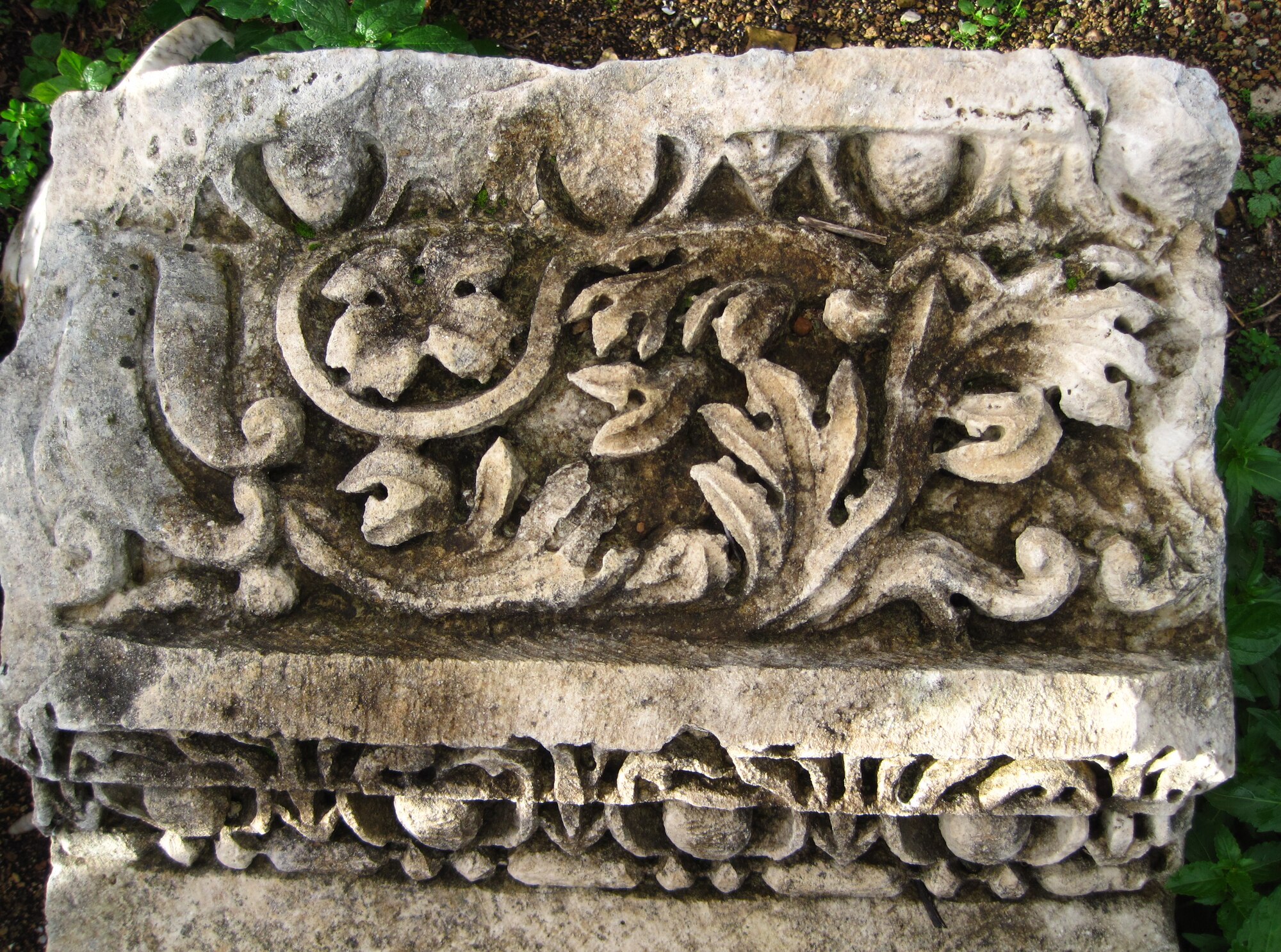 A decorative portion of a collapsed column lies on the ground in the city of Perge. The city is the site to such ruins as a theatre built in 1000 B.C. and a stadium used for horse racing and animal fighting. (U.S. Air Force photo/Senior Airman Sara Csurilla)