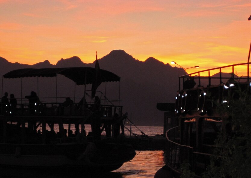A colorful sunset fills the sky over the harbor and rugged mountains which can be seen on a clear day across the bay. Sightseeing boat trips are available in the harbor for about 10TL. (U.S. Air Force photo/Senior Airman Sara Csurilla)