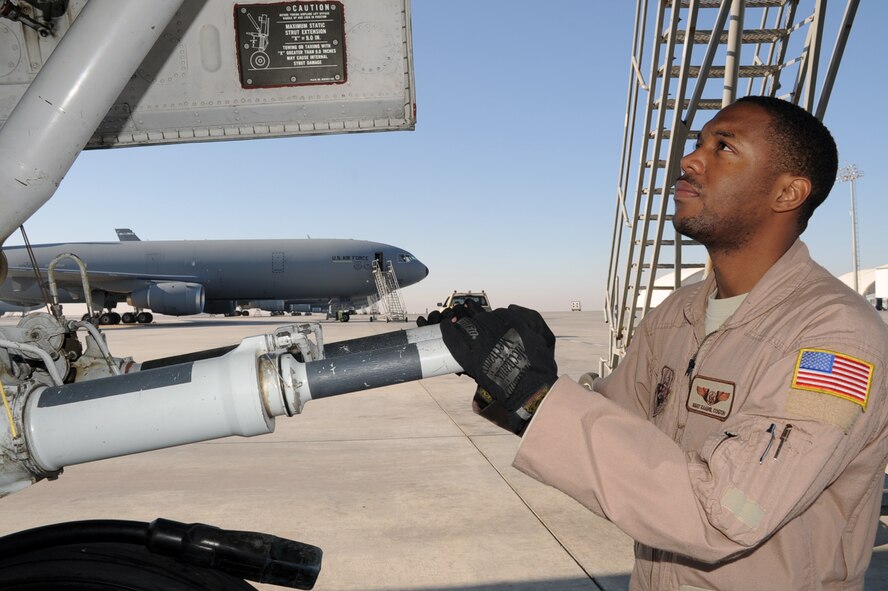Staff Sgt. Kaamil Coston, KC-10 Extender flight engineer with the 908th Expeditionary Air Refueling Squadron at a non-disclosed base in Southwest Asia, checks the landing gear of a KC-10 Jan. 8, 2009.  Sergeant Coston, deployed from the 2nd Air Refueling Squadron at McGuire Air Force Base, N.J., ensures the KC-10 is ready to fly when a mission is prepared -- essentially the "systems expert" for the airframe.  The KC-10 is an Air Mobility Command advanced tanker and cargo aircraft designed to provide increased global mobility for U.S. armed forces. Although the KC-l0's primary mission is aerial refueling, it can combine the tasks of a tanker and cargo aircraft by refueling fighters and simultaneously carry the fighter support personnel and equipment on overseas deployments. Sergeant Coston's hometown is Staten Island, N.Y.  (U.S. Air Force Photo/Tech. Sgt. Scott T. Sturkol/Released) 
