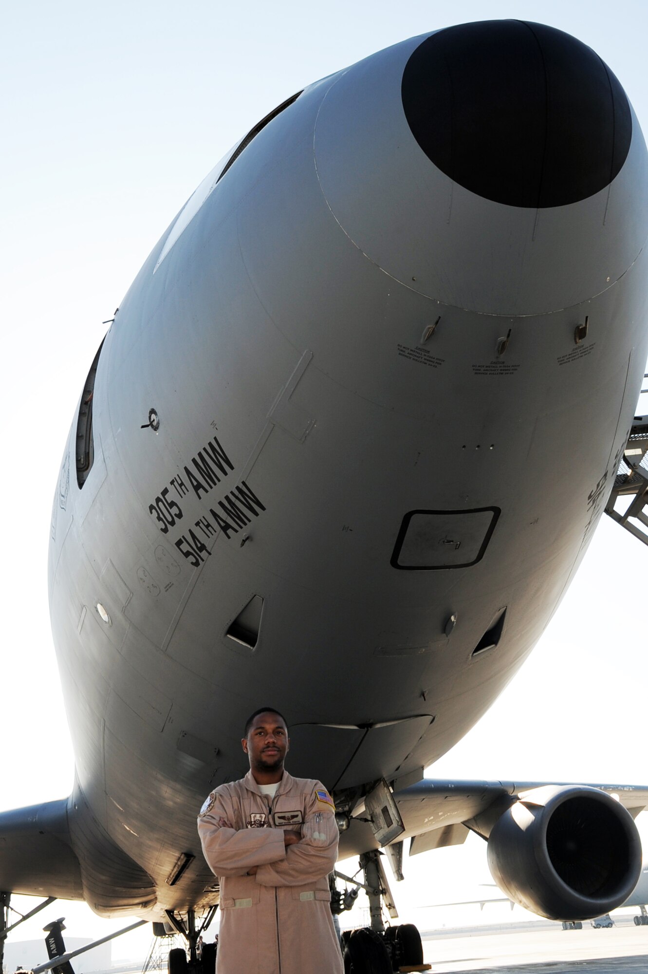 Staff Sgt. Kaamil Coston, KC-10 Extender flight engineer with the 908th Expeditionary Air Refueling Squadron at a non-disclosed base in Southwest Asia, stands in front of a KC-10 Jan. 8, 2009.  Sergeant Coston, deployed from the 2nd Air Refueling Squadron at McGuire Air Force Base, N.J., ensures the KC-10 is ready to fly when a mission is prepared -- essentially the "systems expert" for the airframe.  The KC-10 is an Air Mobility Command advanced tanker and cargo aircraft designed to provide increased global mobility for U.S. armed forces. Although the KC-l0's primary mission is aerial refueling, it can combine the tasks of a tanker and cargo aircraft by refueling fighters and simultaneously carry the fighter support personnel and equipment on overseas deployments. Sergeant Coston's hometown is Staten Island, N.Y.  (U.S. Air Force Photo/Tech. Sgt. Scott T. Sturkol/Released) 