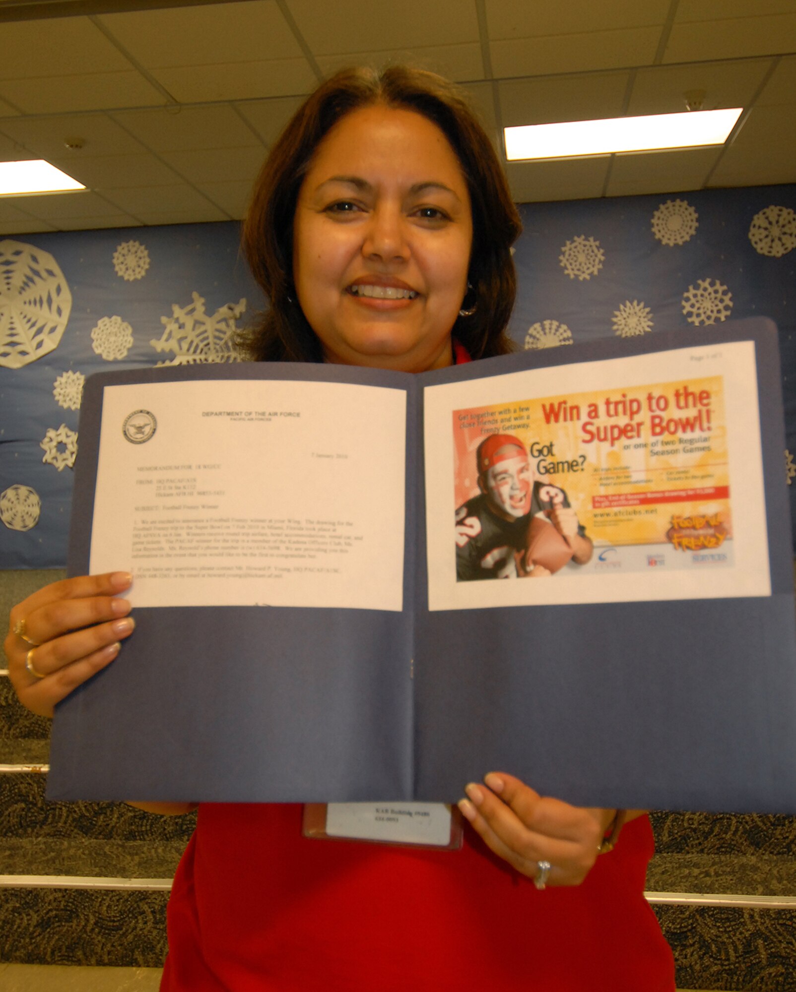 Lisa Reynolds, a Bob Hope Primary School teacher, found out Jan. 8 that she had won an all expense paid trip for two to this year's Super Bowl as part of the Air Force Services Football Frenzy contest. Mrs. Reynolds was selected as the winner for Pacific Air Force Bases to attend the Super Bowl in Miami Feb. 7. Her prize includes two airline tickets, hotel accomodations, rental car and tickets to the game. (Air Force/Staff Sgt. Jason Lake) 