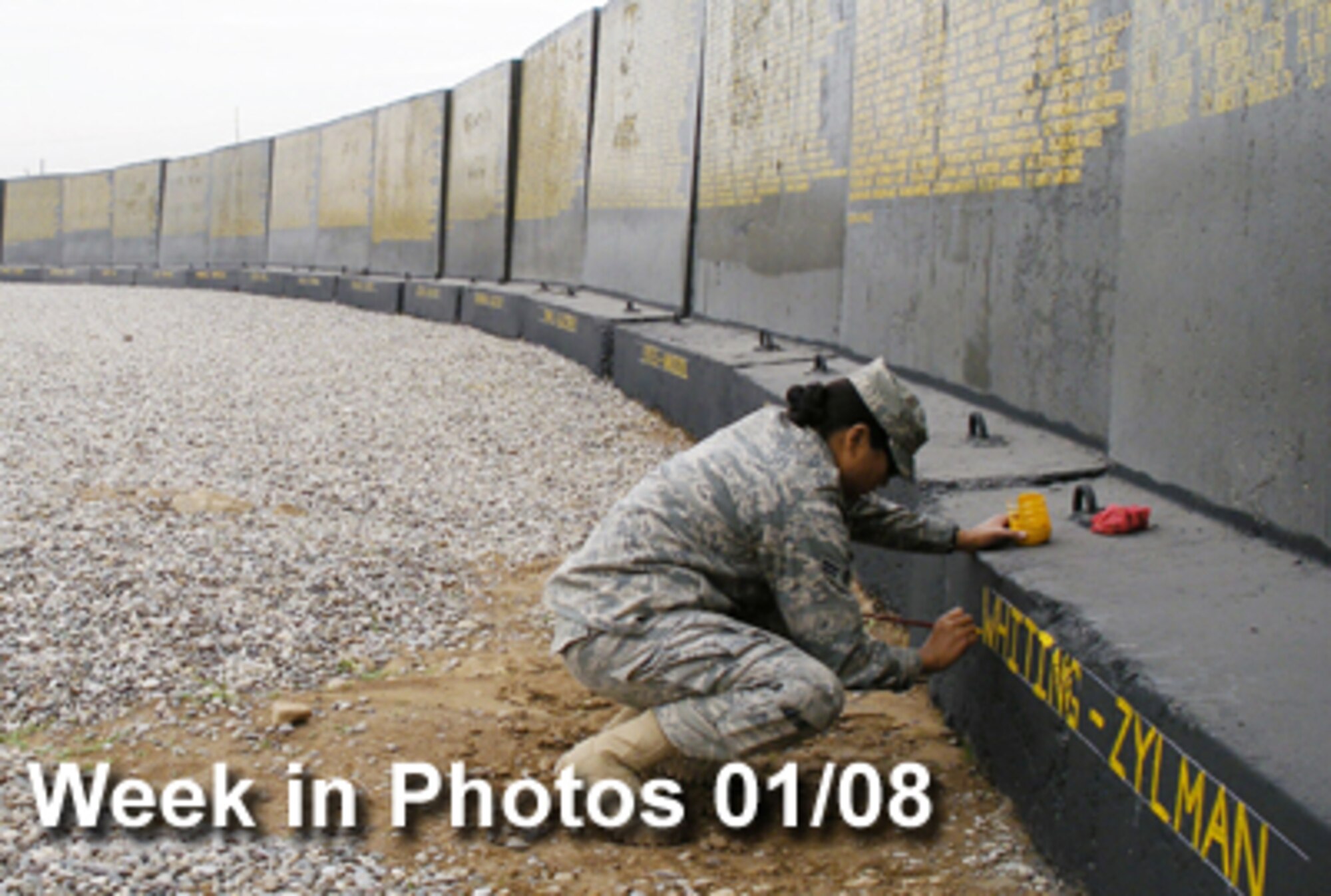 Air Force Week in Photos for Jan. 8, 2010, highlights photos from around the Air Force. In this photo, Airman 1st Class Tanja Kambel updates the memorial wall at Kirkuk Regional Air Base, Iraq. The memorial wall holds the names of all the servicemembers who lost their lives during Operation Iraqi Freedom since the start of the campaign in 2003. (U.S. Air Force illustration)
