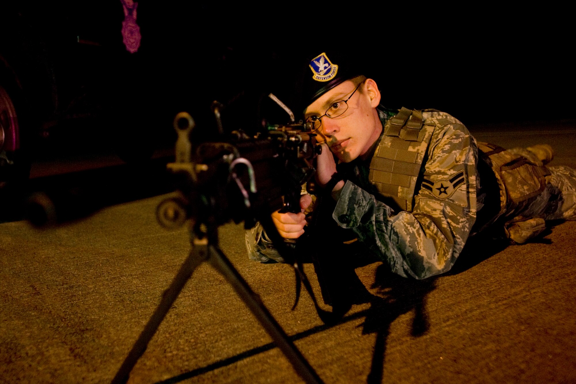 MISAWA AIR BASE, Japan -- Airman 1st Class Joshua Williams, 35th Security Forces Squadron patrolman, lies in the prone position during a simulated security breach Jan. 7 on the flightline. The 35th SFS conducts various daily training exercises in efforts to keep defenders proficient at performing duties. (U.S. Air Force photo/Senior Airman Jamal D. Sutter)