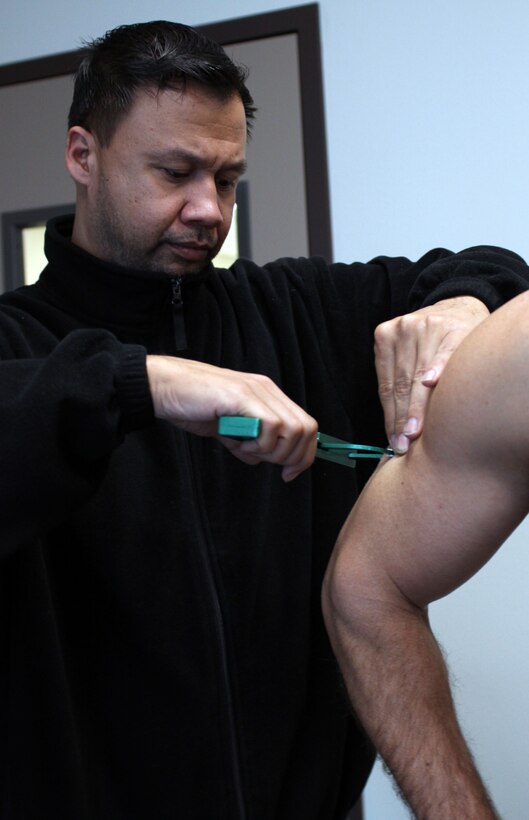 Ron S. Rivera, fitness center supervisor, measures fat percentage with a pinch caliber test Jan. 8 at the Marine Corps Recruit Depot San Diego fitness center. Recruiter school students who participated in the "Maintain, Don't Gain" program had their body fat percentage measured and got weighed in every week.