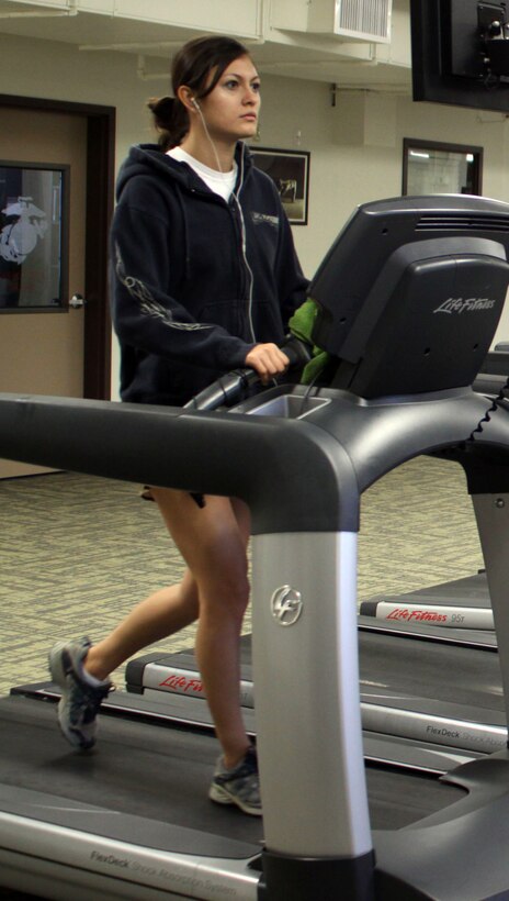 Cpl. Deborah Young, customer service clerk, finance office, uses the cardio equipment Jan. 8 at the Marine Corps Recruit Depot San Diego fitness center. Participants in the "Maintain, Don't Gain" program also used the equipment to maintain their weight over the holidays.