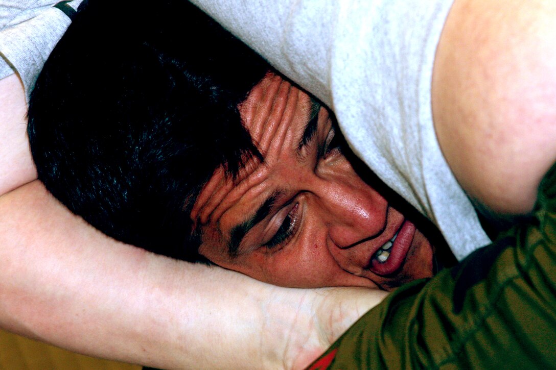Fight Club 29 fighter Joey Yeamperre struggles for air as he tries to defeat his opponent Sean LeBard at the Grappling Experience Tournament in Las Vegas Jan. 9. The team won an overall gold medal for the event, with 12 individual medalists.