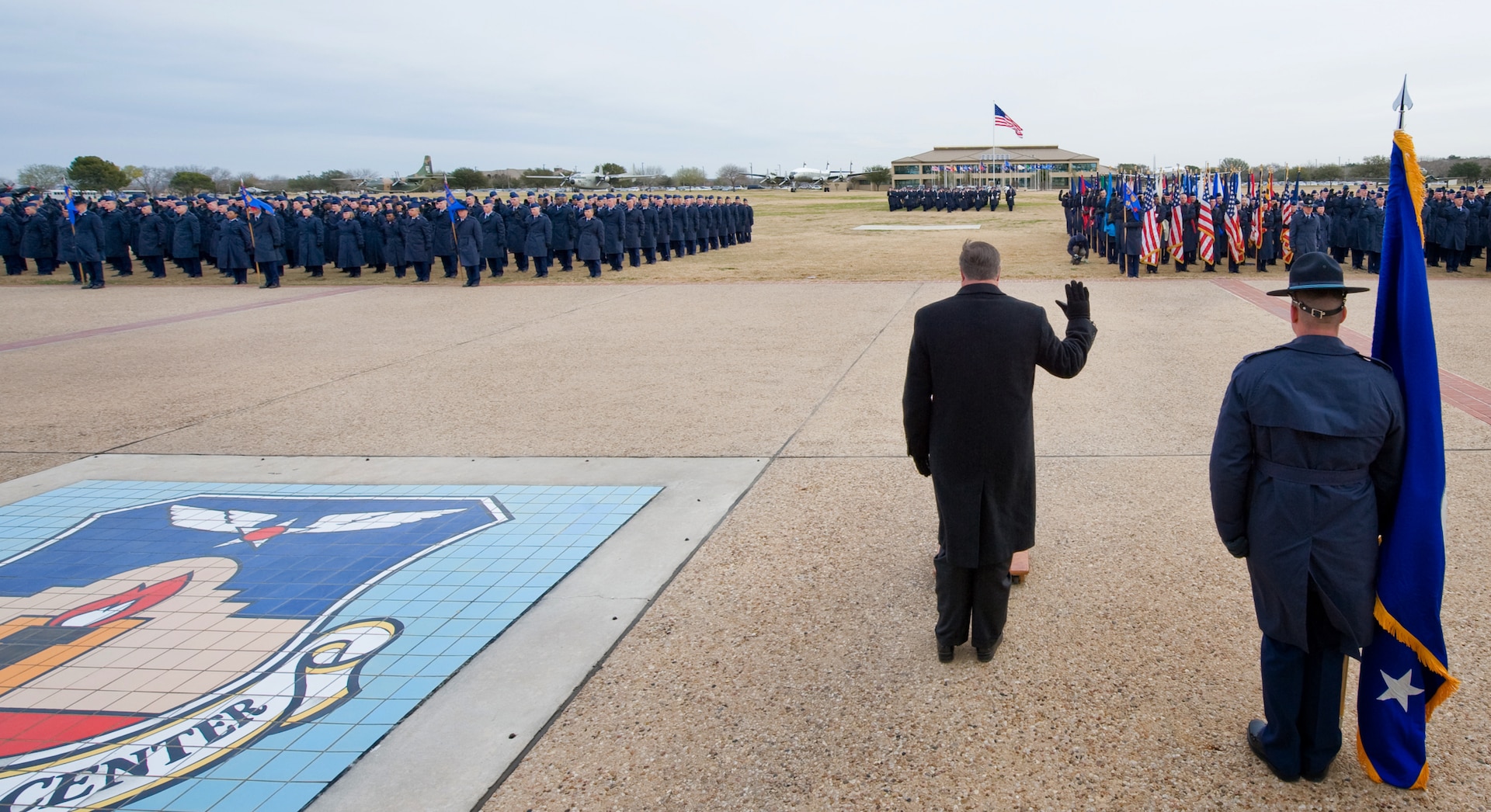 Secretary of the Air Force Michael Donley officiates the oath of enlistment to graduates of Basic Military Training Jan. 8, 2010, at Lackland Air Force Base, Texas. (U.S. Air Force photo/Lance Cheung)