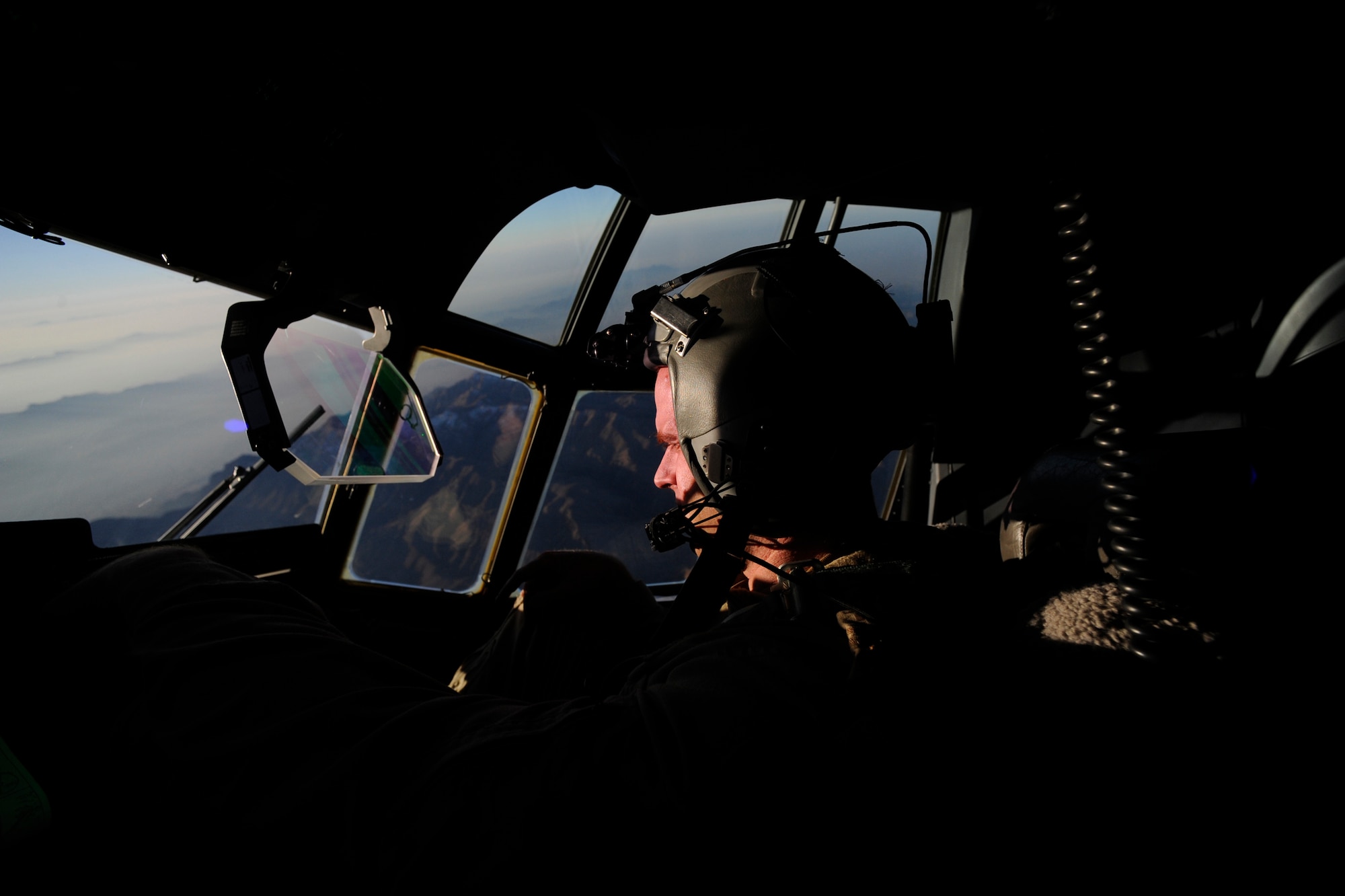 Canadian Air Force Capt. Ryan Peters,  772nd Expeditionary Airlift Squadron C-130J Super Hercules pilot monitors the heads-up display (HUD) during a routine channel mission, Jan. 7. in Afghanistan. Capt. Peters is from the Alberta providence of Canada. A routine channel mission is a twelve-hour shift consisting of delivering passengers and cargo to various locations throughout Afghanistan. (U.S. Air Force/Staff Sgt. Manuel J. Martinez)