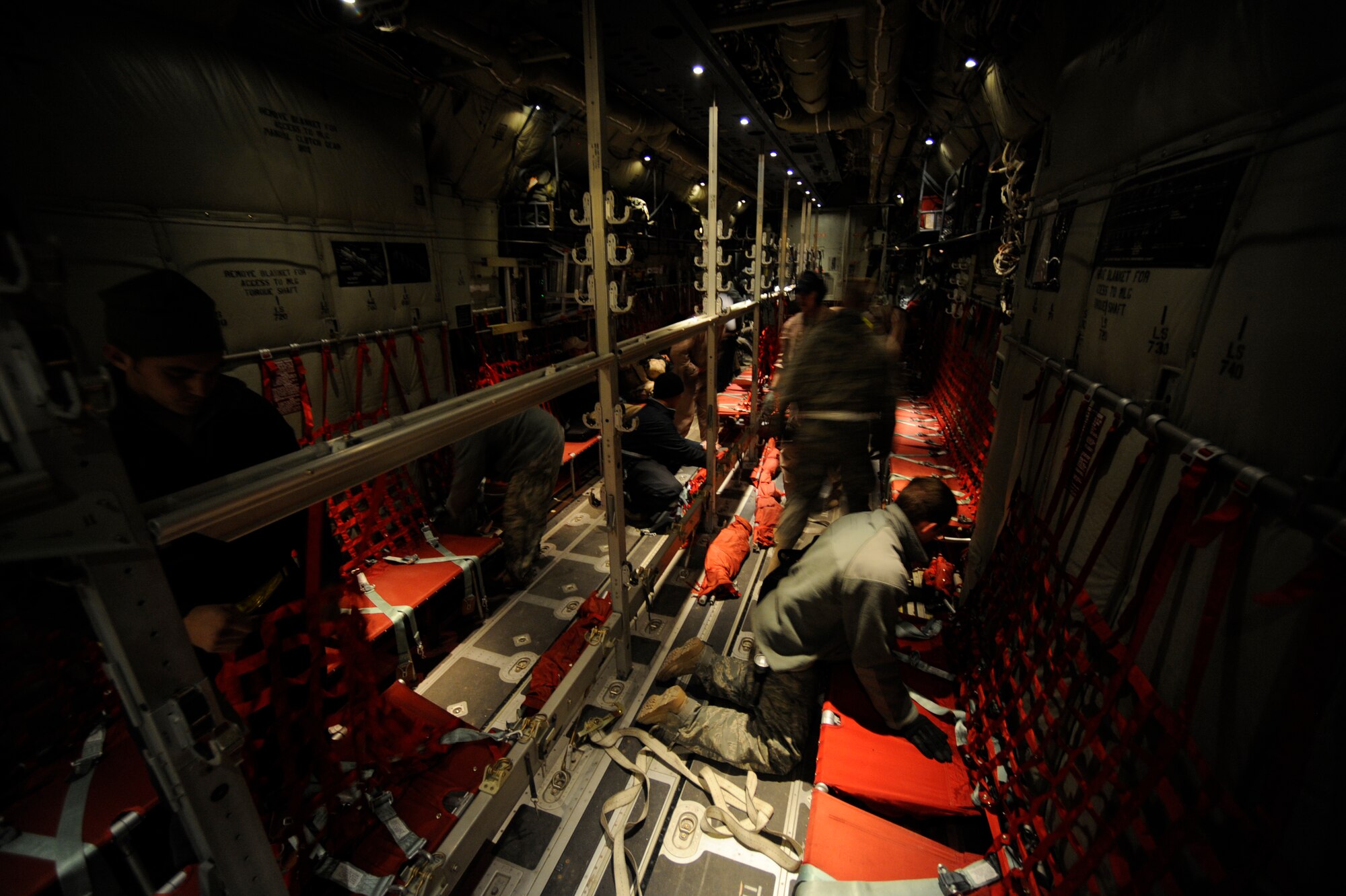 Flight-line maintenance and a C-130J Super Hercules aircrew configure the a "Super Hercules" for 70 passengers on a routine channel mission, Jan. 7. at Kandahar Air Field, Afghanistan.  (U.S. Air Force/Staff Sgt. Manuel J. Martinez)