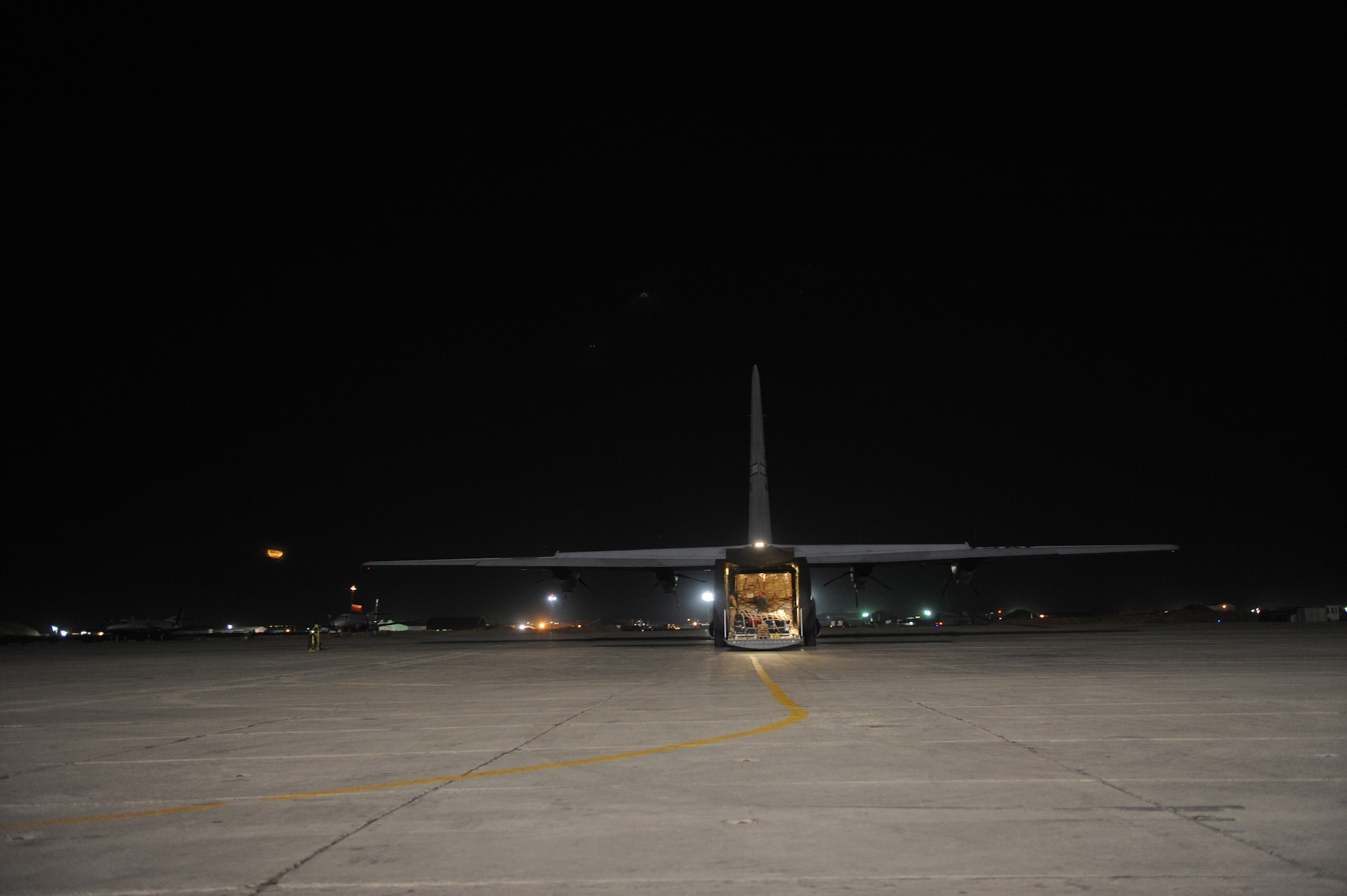 A C-130J Super Hercules waits for its crew to load all passengers and cargo  during a routine channel mission, Jan. 6 at Bagram Air Base Air Base, Afghanistan. The Aircraft and crew are deployed from Little Rock Air Force Base, Ark. As of Jan. 5, since their arrival almost 10 months ago, 772nd Airmen have delivered 13,991 tons of cargo; hauled 54,034 passengers; flown 5,557 hours; airlifted 255 patients; airdropped 1,167 tons of fuel , food, ammunition and water;  and conducted an emergency resupply.  (U.S. Air Force photo/Staff Sgt. Manuel J. Martinez)
U.S. Air Force/Staff Sgt. Manuel J. Martinez)