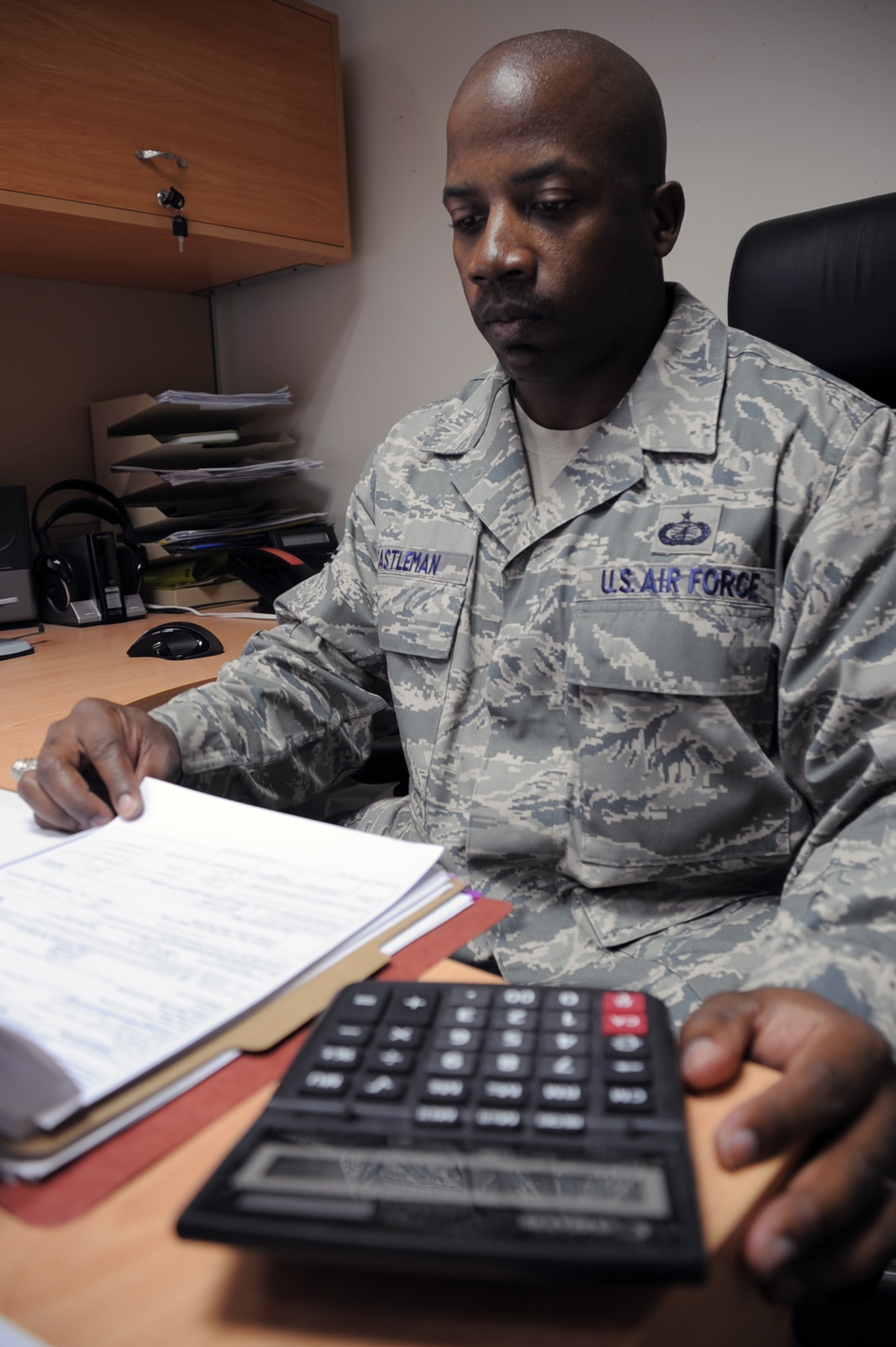 Tech. Sgt. Craig Castleman, a contracting craftsman with the 380th Expeditionary Contracting Squadron at a non-disclosed base in Southwest Asia, works on a contract in his office at his deployed location Jan. 8, 2009. Sergeant Castleman, deployed from the 43rd Contracting Squadron at Pope Air Force Base, N.C., is the 380th ECONS contingency contracting flight chief.  His hometown is Shelbyville, Tenn. (U.S. Air Force Photo/Tech. Sgt. Scott T. Sturkol/Released)