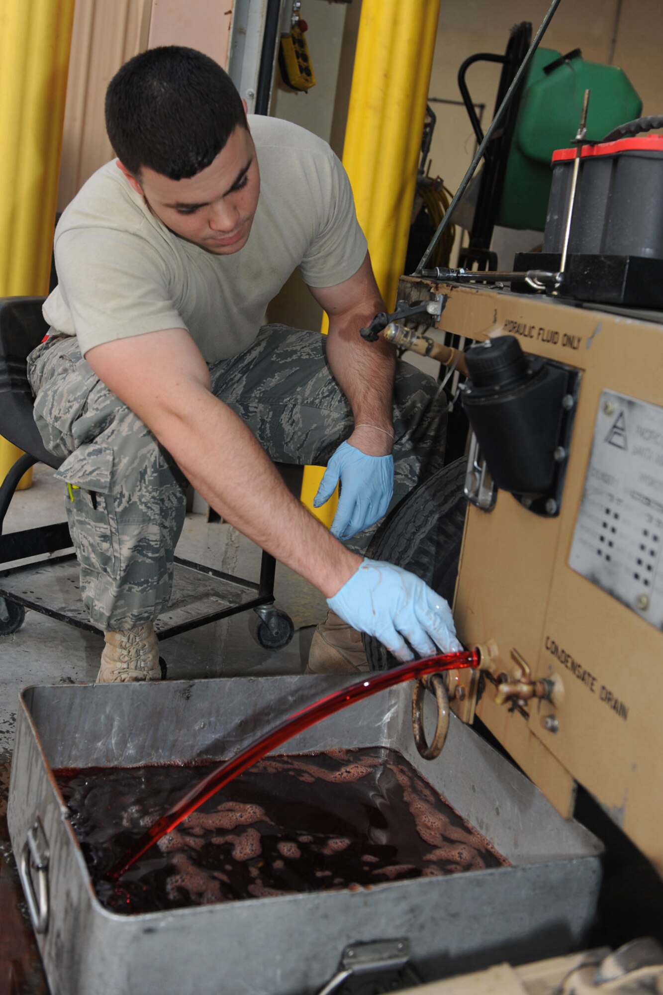 Senior Airman Kevin Desautels , 379 Expeditionary Maintenace Squadron/Aircraft Generation Equipment, changes a hydraulic gauge on a self generating nitrogen cart at an undisclosed location, Southwest Asia, Jan. 7, 2010. The nitrogen cart is used for servicing aircraft struts or tires. Airman Desautels hails from Ellsworth AFB, SD. (U.S. Air Force photo by Tech. Sgt. Michelle Larche)