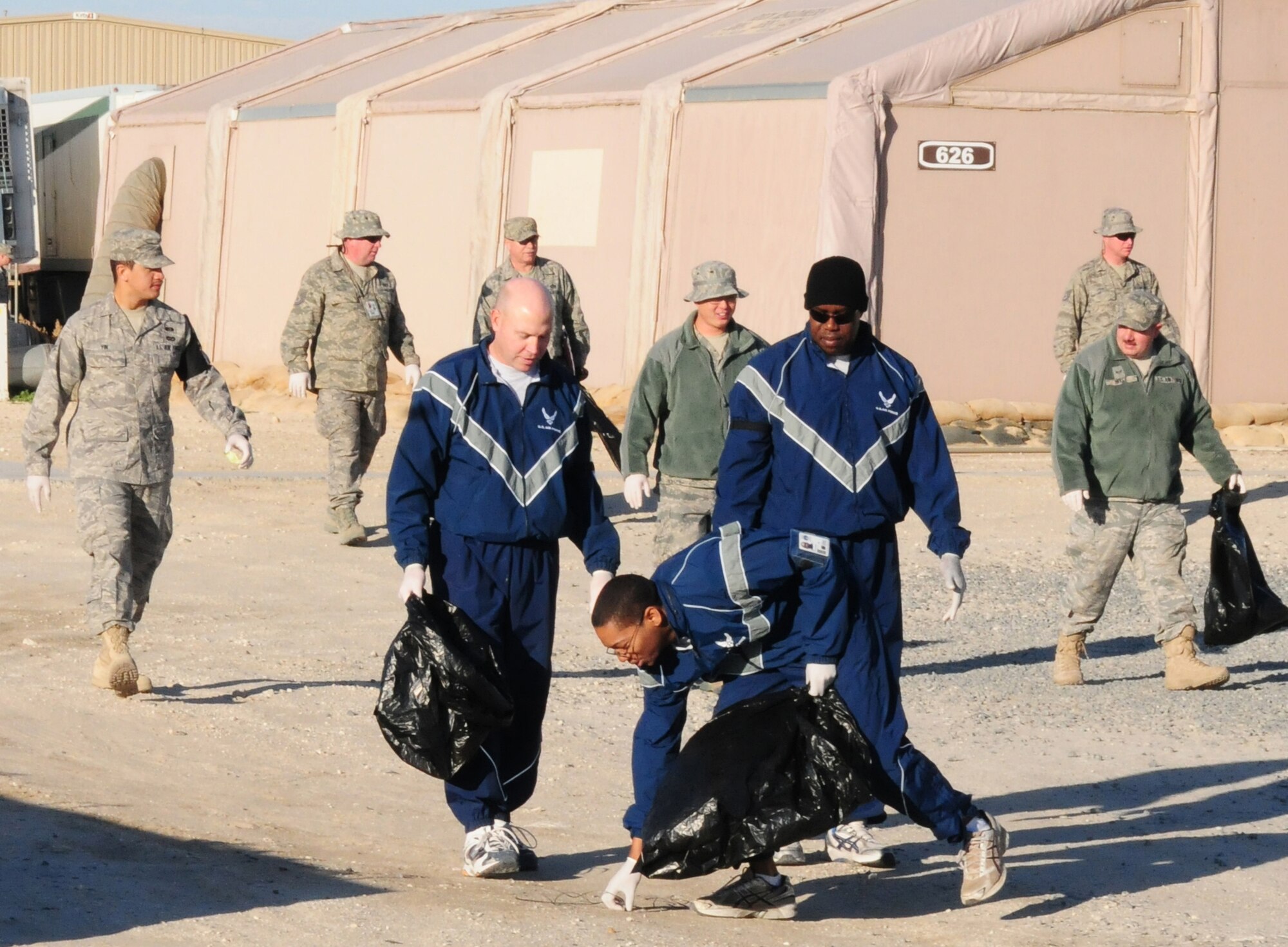 SOUTHWEST ASIA -- Airmen of the 386th Air Expeditionary Wing spend their morning cleaning up "The Rock", an air base in Southwest Asia, Jan. 9, 2010. The volunteer-based detail is held every Saturday morning. (U.S. Air Force photo by Staff Sgt. Lakisha A. Croley/Released)