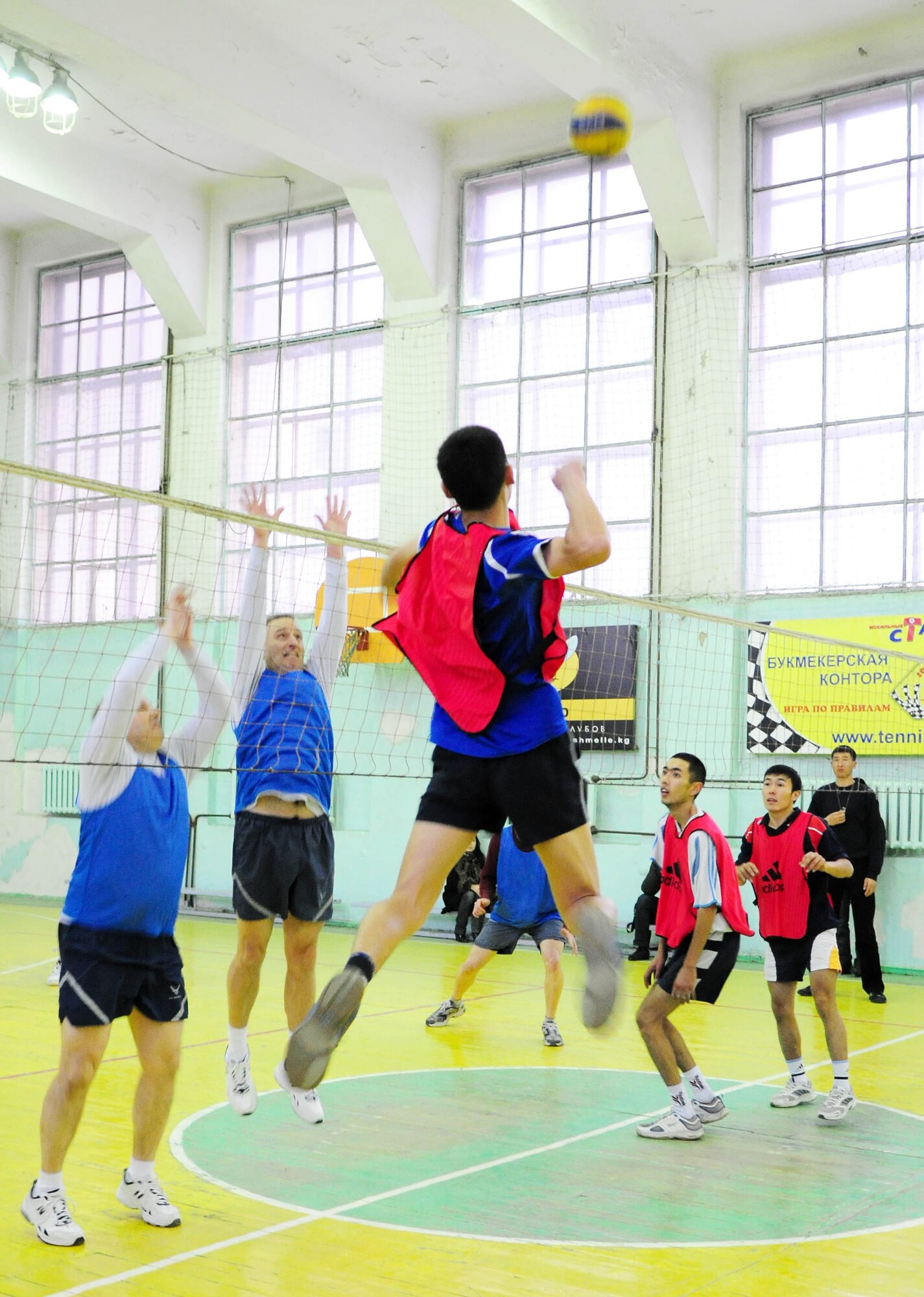 BISHKEK, Kyrgyzstan - An athlete from the Academy of Physical Culture and Sports prepares to spike the volleyball against the Transit Center at Manas team here Jan. 8. The Kyrgyz team is comprised of full-time athletes, while the TC team is primarily made up of military servicemembers. U.S. Air Force photo by Senior Airman Nichelle Anderson)