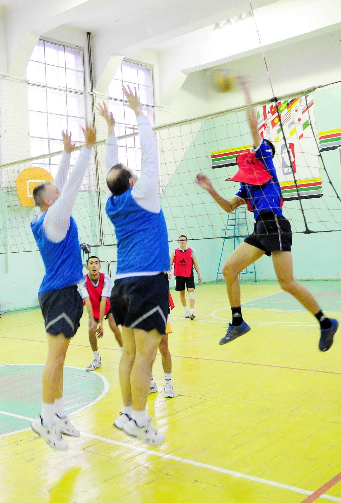 BISHKEK, Kyrgyzstan - An athlete from the Academy of Physical Culture and Sports goes up for a spike during a friendly volleyball match against the Transit Center at Manas team Jan. 8. The Kyrgyz team is comprised of full-time athletes, while the TC team is primarily made up of military servicemembers. In spite of the American?s loss, the friendly relationship established between the two teams helped build a strong community bond. (U.S. Air Force photo by Senior Airman Nichelle Anderson)