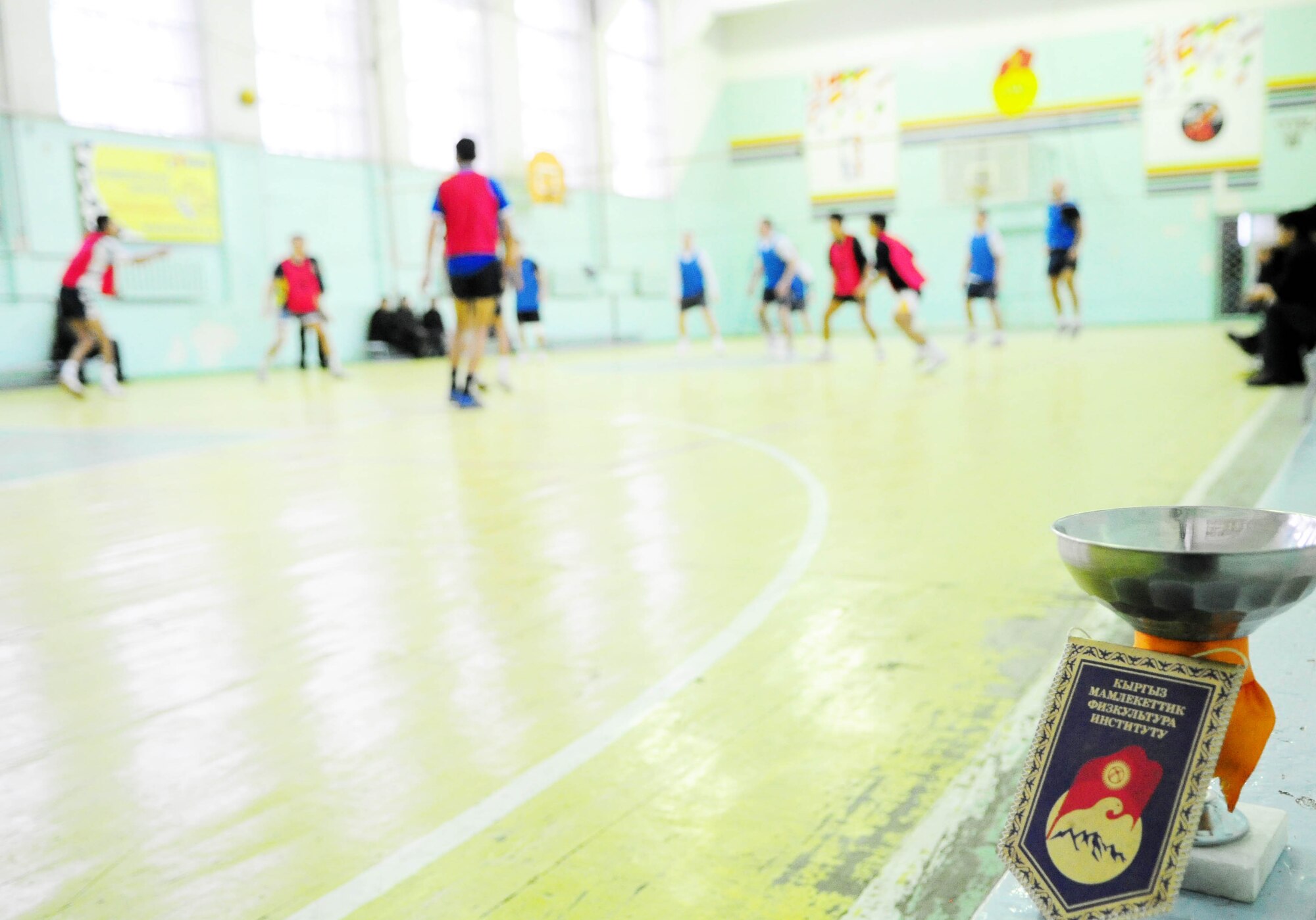 BISHKEK, Kyrgyzstan - The Transit Center at Manas volleyball team faced off with the Academy of Physical Culture and Sports here Jan. 8. Although the Airmen lost the match, the Kyrgyz team presented the TC team with a trophy in appreciation of good sportsmanship. (U.S. Air Force photo by Senior Airman Nichelle Anderson)