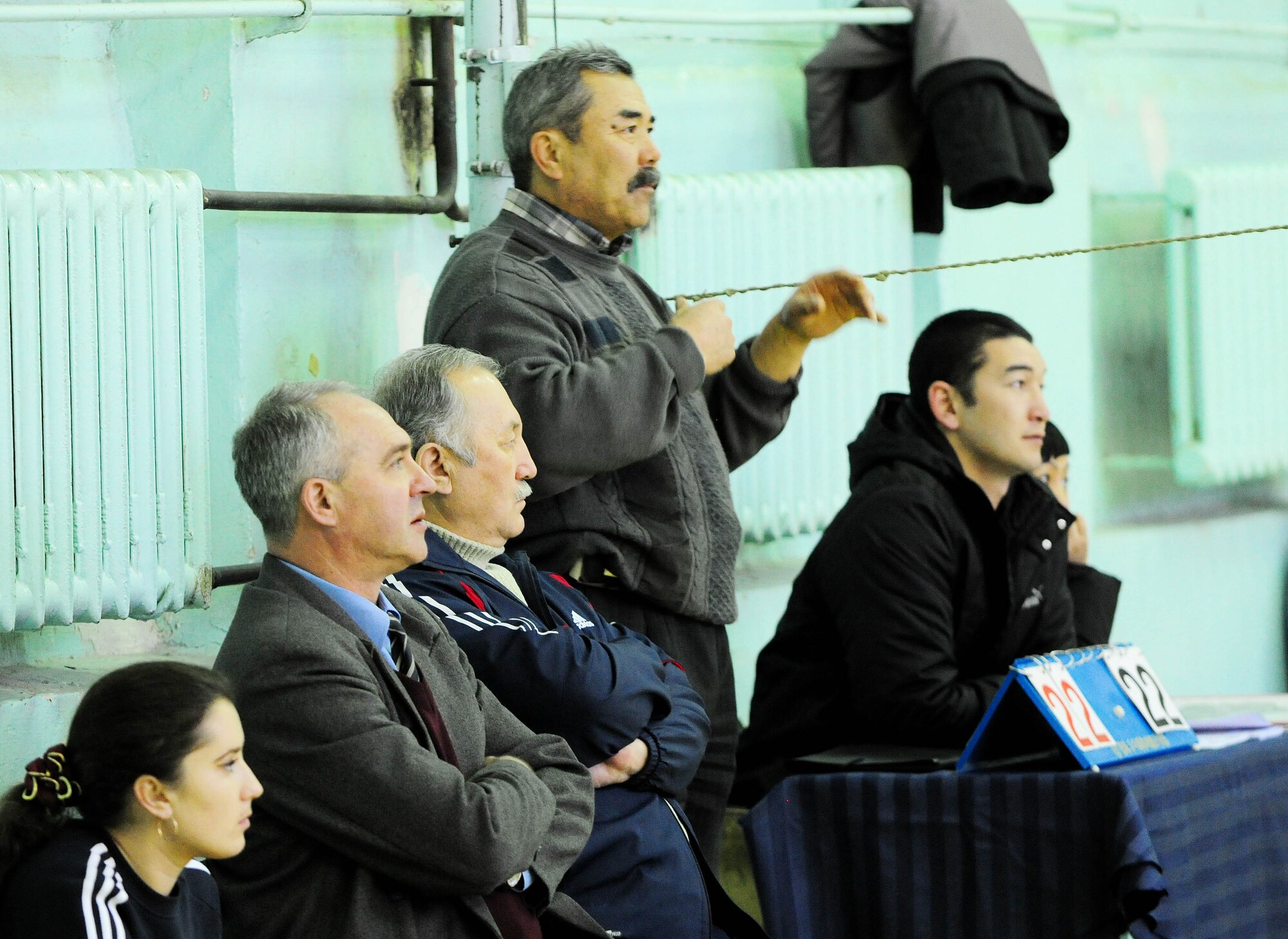 BISHKEK, Kyrgyzstan - The Academy of Physical Culture and Sports volleyball coach and other academy officials watch a friendly game of volleyball between the APCS and the Transit Center at Manas team here Jan. 8. (U.S. Air Force photo by Senior Airman Nichelle Anderson)
