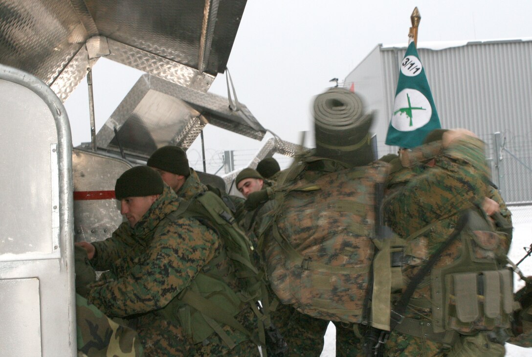 Soldiers from the Republic of Georgia Army's 31st Light Infantry Battalion gather their gear after arriving at the Nrnberg International Airport here. The Georgian battalion will be participating in a two-week mission readiness exercise for their upcoming deployment to Afghanistan in support of International Security Assistance Forces there. The exercise will take place at the Joint Multination Readiness Center in Hohenfels, Germany and feature multinational observer controllers and role players from the U.S. Marine Corps, U.S. Army, and Slovenian Army.
