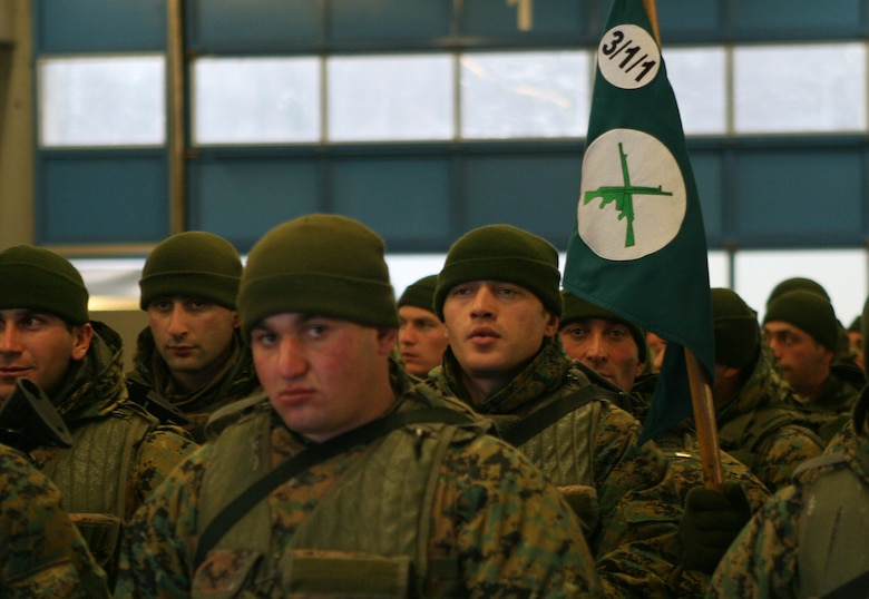 Soldiers from the Republic of Georgia Army's 31st Light Infantry Battalion gather their gear after arriving at the Nrnberg International Airport here. The Georgian battalion will be participating in a two-week mission readiness exercise for their upcoming deployment to Afghanistan in support of International Security Assistance Forces there. The exercise will take place at the Joint Multination Readiness Center in Hohenfels, Germany and feature multinational observer controllers and role players from the U.S. Marine Corps, U.S. Army, and Slovenian Army.