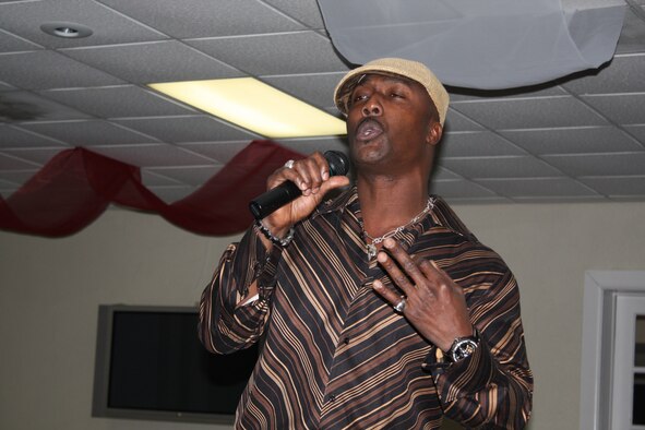 Capt. Marlon Ferdinand of the medical squadron was the nights featured poet for the 482nd Mission Support Squadron Unit Advisory Council's poetry reading held at the Falcon's Nest Club, Jan. 9. (U.S. Air Force photo/ Senior Airman Katie Spencer)