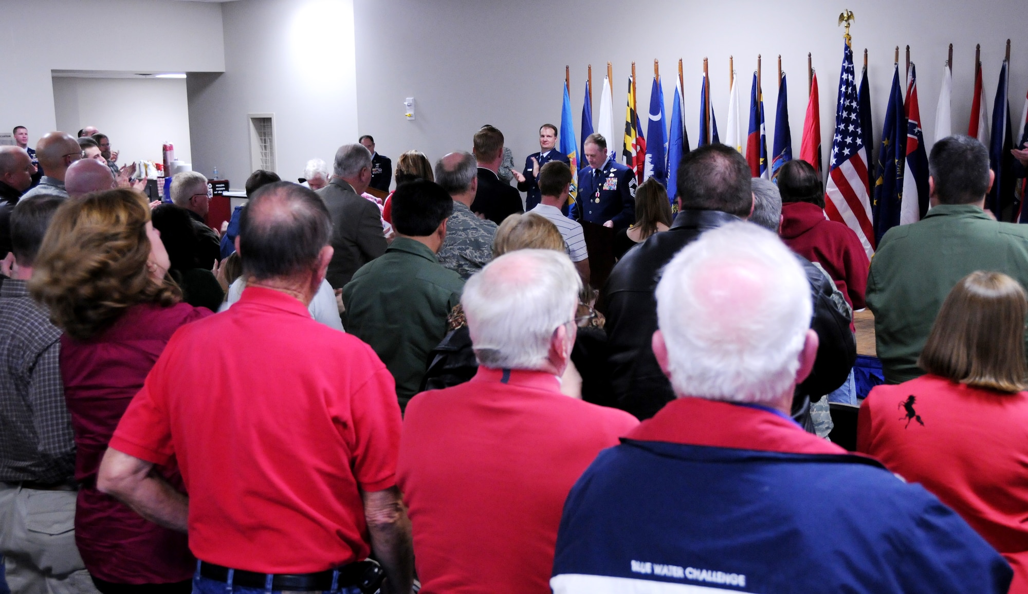 Chief Master Sgt. Lyle Spangler gets a standing ovation from the crowd during his retirement ceremony at Duke Field, Jan. 9.  Chief Spangler began his 36-year career in 1974 and transitioned to the reserves in 1978.  The chief completed his career as a member of the 711th Special Operations Squadron.  U.S. Air Force photo by Tech. Sgt. Samuel King Jr.