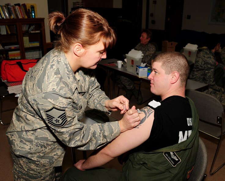 NIAGARA FALLS AIR RESERVE STATION, NY--Master Sgt Heather Gustafson administers the H1N1 vaccination to Senior Airman Evan Kieber, 914th Airlift Wing, January 9. (U.S. Air Force photo by Staff Sgt Stephanie Clark) (Released) 