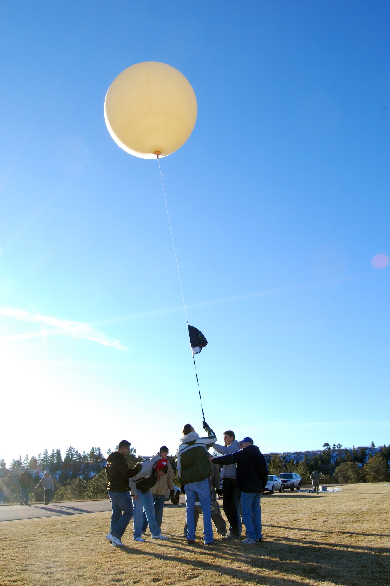 Air Force Academy cadets prepare to launch a weather balloon named "Roswell II" from the Academy's Stillman Parade Field Jan. 10, 2010. The cadets launched the balloon as part of a Space Club experiment after notifying officials at Denver International and Colorado Springs airports. (U.S. Air Force photo/Staff Sgt. Don Branum)