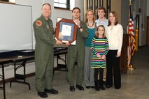 174th Fighter Wing Commander Col. Kevin W. Bradley presents Col. Greg A. Semmel with the "Hometown Heroes" plaque. The plaque is given out to members of the Air National Guard who have deployed since the attacks on September 11th in support of Operations Enduring Freedom and Iraqi Freedom. (RELEASED)