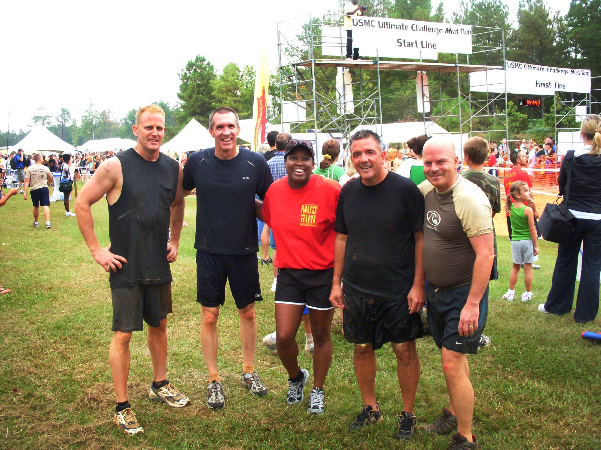 After participating in the Mud Run, Major Tommy Ferguson, Capt Sam Ingram, MSgt Pam McCraney, LtCol Windell Robertson, LtCol Pete Fenn take a group shot.  Photo courtesy of Maj Sam Ingram, 145th Medical Group.
