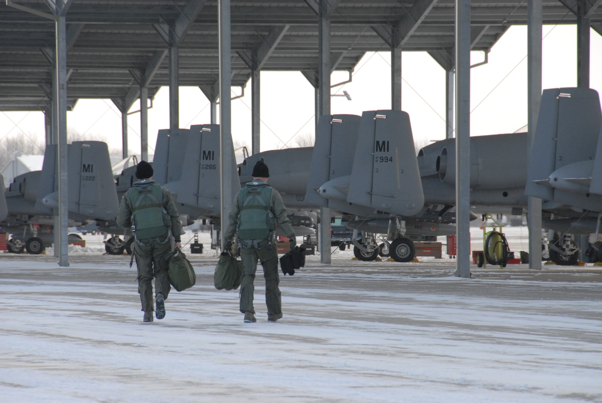 Pilots of the 107th Fighter Squadron step to the A-10s that they will deploy in as part of "Operation Demons to DM" on Saturday, January 9.  After just six months of flying the A-10 mission from Selfridge Air National Guard Base, the 107th's "Red Devils" along with approximately 120 maintenance and support personnel, deployed to Davis-Monthan AFB, Ariz.  There, the Michigan Guardsmen will take advantage of the ideal weather conditions to increase training tempos to prepare to upcoming missions in support of global operations.