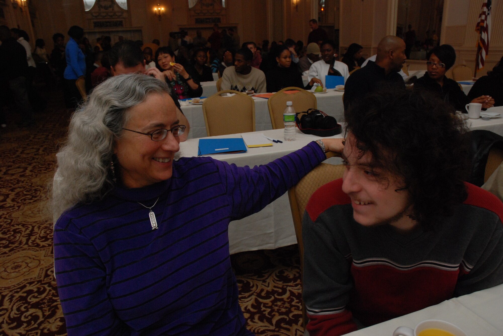 Senior Master Sgt. Emily Samfield, 94th Aeromedical Staging Squadron Health Services superintendent, and her son Zephren, enjoy a fun moment during the Yellow Ribbon Reintegration Conference in Chattanooga, Tenn. Jan 9-10.  “This is a great opportunity for my son to interact with other military youth and share regarding his experiences of having a deployed parent,” said Sergeant Samfield.  (U.S. Air Force photo/Master Sgt. Stan Coleman)  