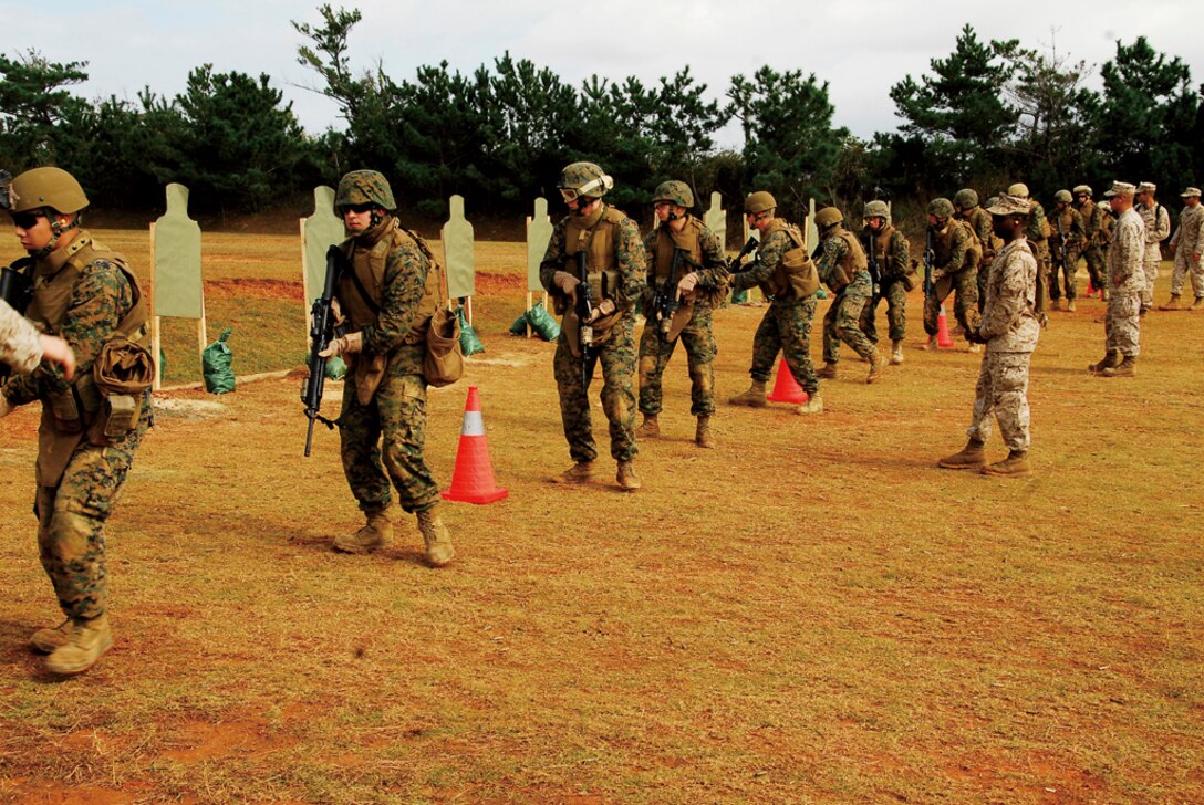 Marines with 5th Air Naval Gunfire Liaison Company, III Marine Expeditionary Force, conduct Table 3 Intermediate Combat Rifle Marksmanship training Jan. 11 on Camp Hansen in preparation for their deployment to Afghanistan in support of Operation Enduring Freedom.
