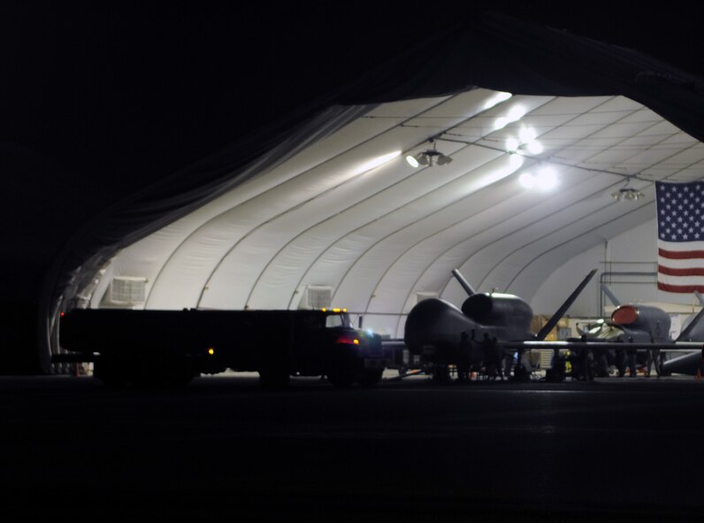 A Global Hawk drone aircraft is being refueled during operations on the flightline of a non-disclosed base in Southwest Asia on Jan. 10, 2010. The aircraft and Airmen, assigned to the 380th Air Expeditionary Wing, support Operations Iraqi Freedom and Enduring Freedom and the Combined Joint Task Force-Horn of Africa. (U.S. Air Force Photo/Tech. Sgt. Scott T. Sturkol/Released)