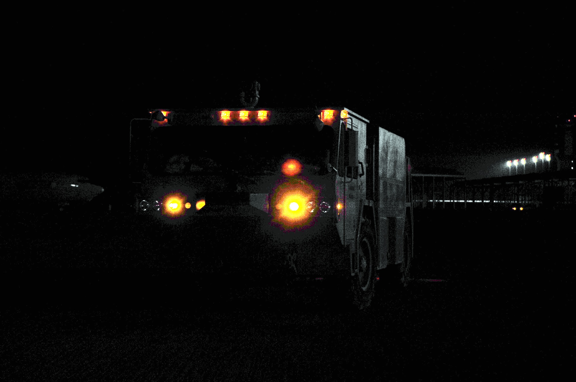 A fire truck is parked on the flightline of a non-disclosed base in Southwest Asia on Jan. 10, 2010. The firemen and fire truck, assigned to the 380th Expeditionary Civil Engineer Squadron of the 380th Air Expeditionary Wing, support Operations Iraqi Freedom and Enduring Freedom and the Combined Joint Task Force-Horn of Africa. (U.S. Air Force Photo/Tech. Sgt. Scott T. Sturkol/Released)
