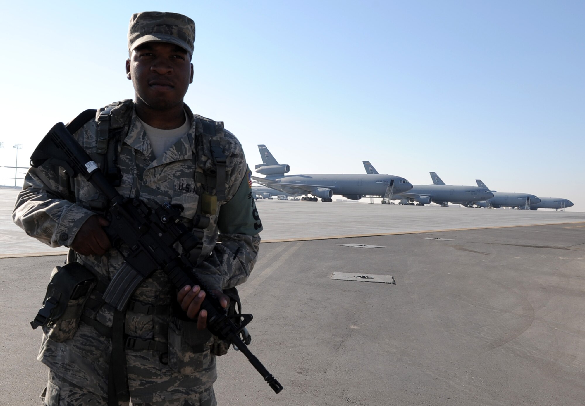 Airman 1st Class William Hollinger, 380th Expeditionary Security Forces Squadron, watches over the flightline at a non-disclosed base in Southwest Asia on Jan. 8, 2010.  The 380th ESFS and the 380th Air Expeditionary Wing support Operations Iraqi Freedom and Enduring Freedom and the Combined Joint Task Force-Horn of Africa. Airman Hollinger is deployed from the 21st Security Forces Squadron and his hometown is Norfolk, Va.  (U.S. Air Force Photo/Tech. Sgt. Scott T. Sturkol/Released)