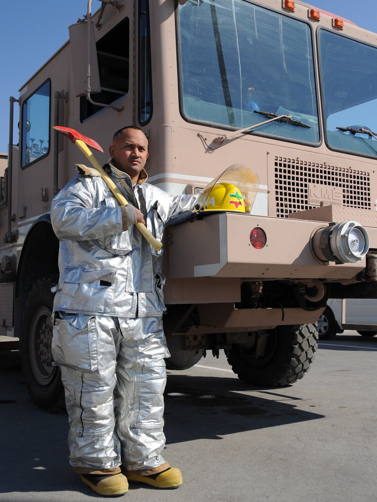 Airman 1st Class Justin T. Rellin, an Air Force firefighter deployed from the 18th Civil Engineer Squadron at Kadena Air Base, Japan, works in the 380th Expeditionary Civil Engineer Squadron's fire department at a non-disclosed base in Southwest Asia.  Airman Rellin was named the 380th Air Expeditionary Wing's "Warrior of the Week" for Jan. 6-12, 2010.  (U.S. Air Force Photo/Senior Airman Jenifer Calhoun/Released) 
